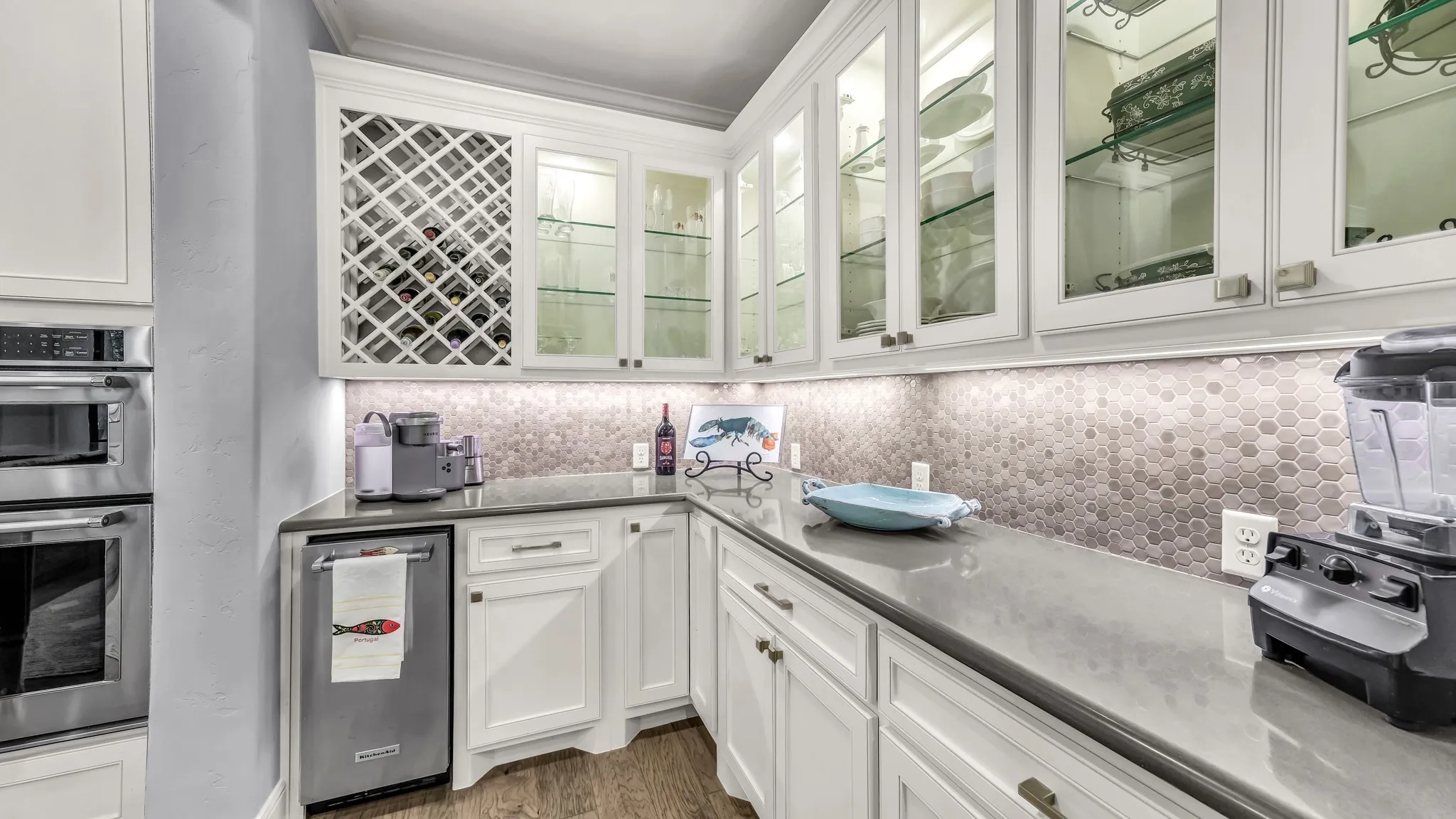 Other view of butler's pantry. Countertops for days, built in wine holder, and built in wine machine.