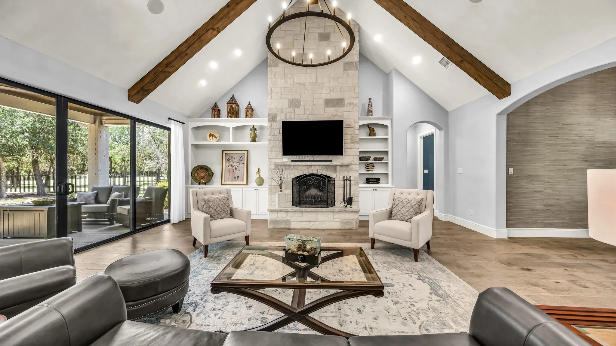 From the kitchen, this is the absolutely gorgeous view of the living room. Bright and beautiful, with wooden beams.