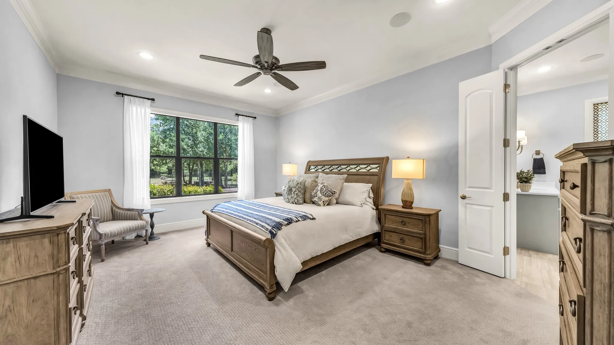 Primary suite. Large space with enough room for large furniture and a sitting area.