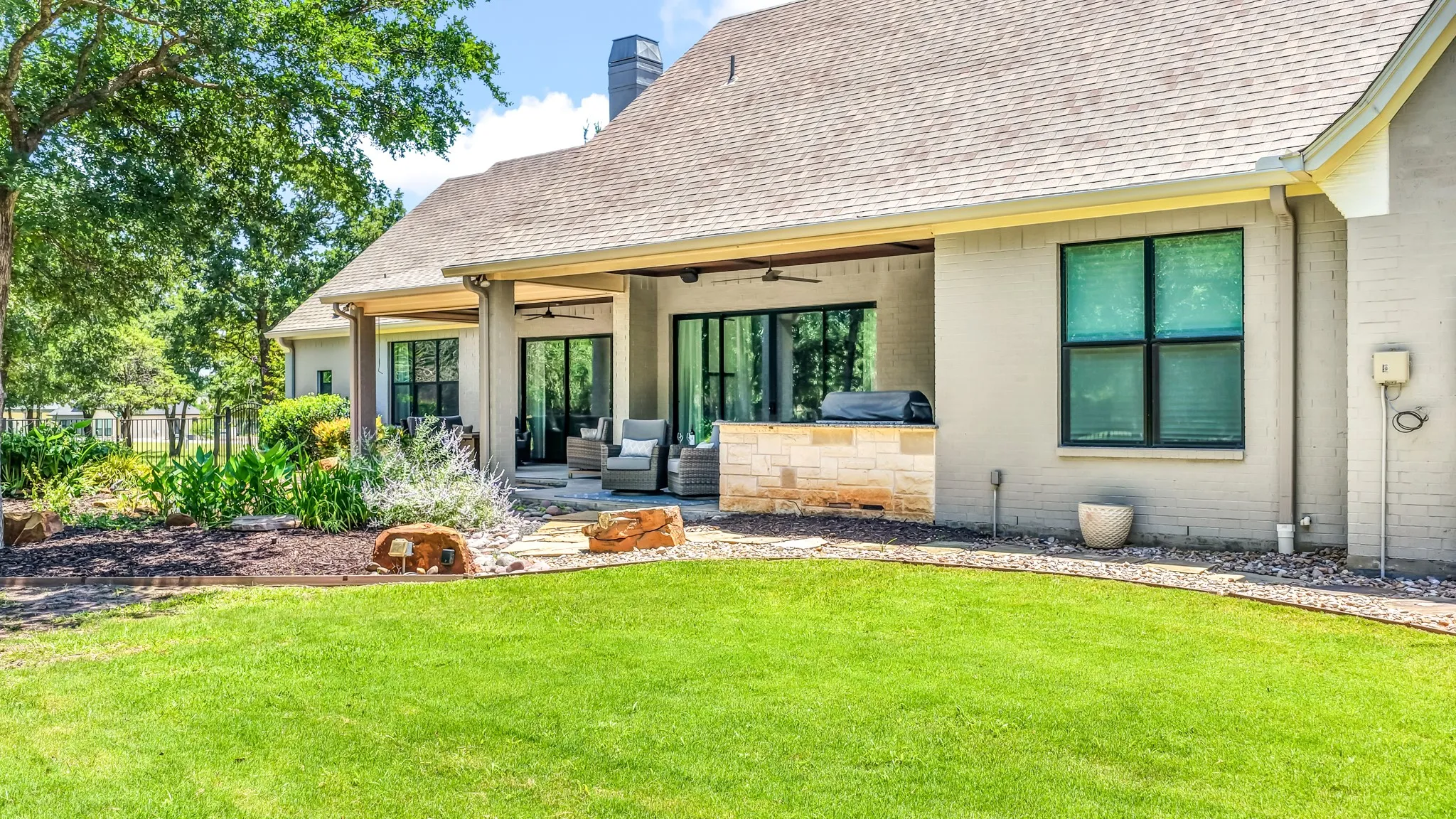 Rear view of home and both patios.