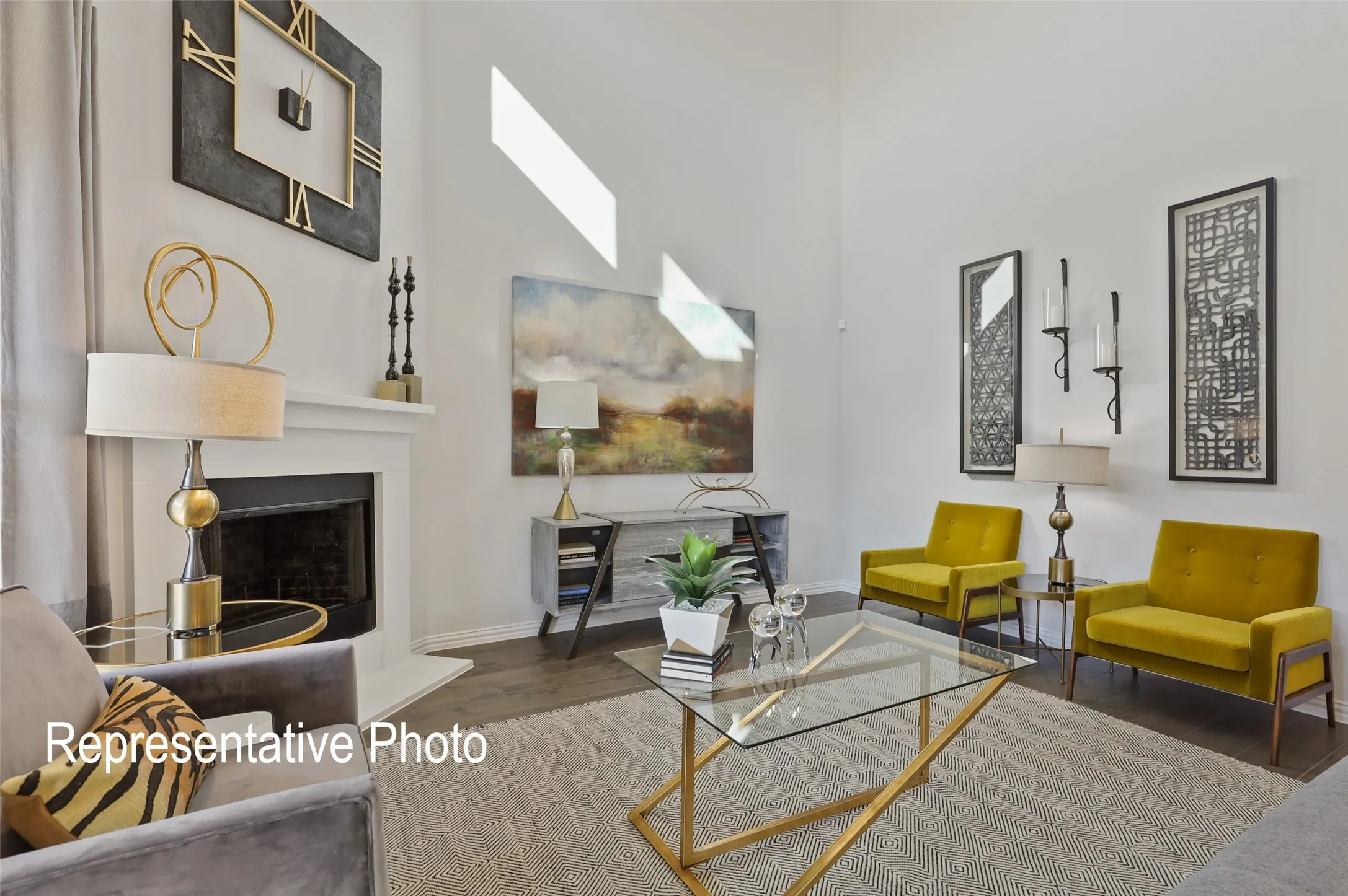 Spacious living area featuring a white mantel fireplace, tall ceilings, recessed lighting, and wood-finish flooring