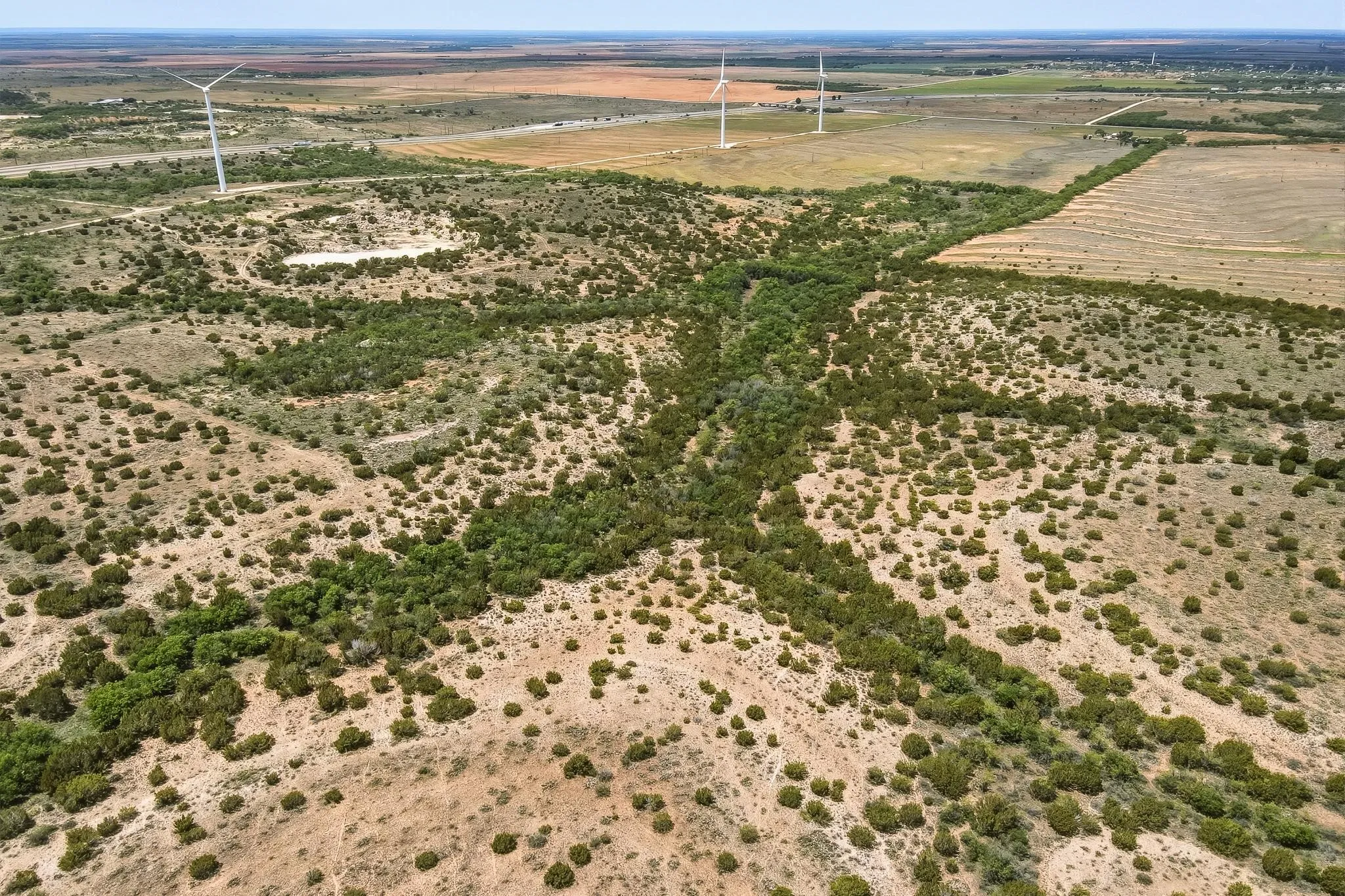 Expansive undeveloped land featuring natural vegetation and cleared areas
