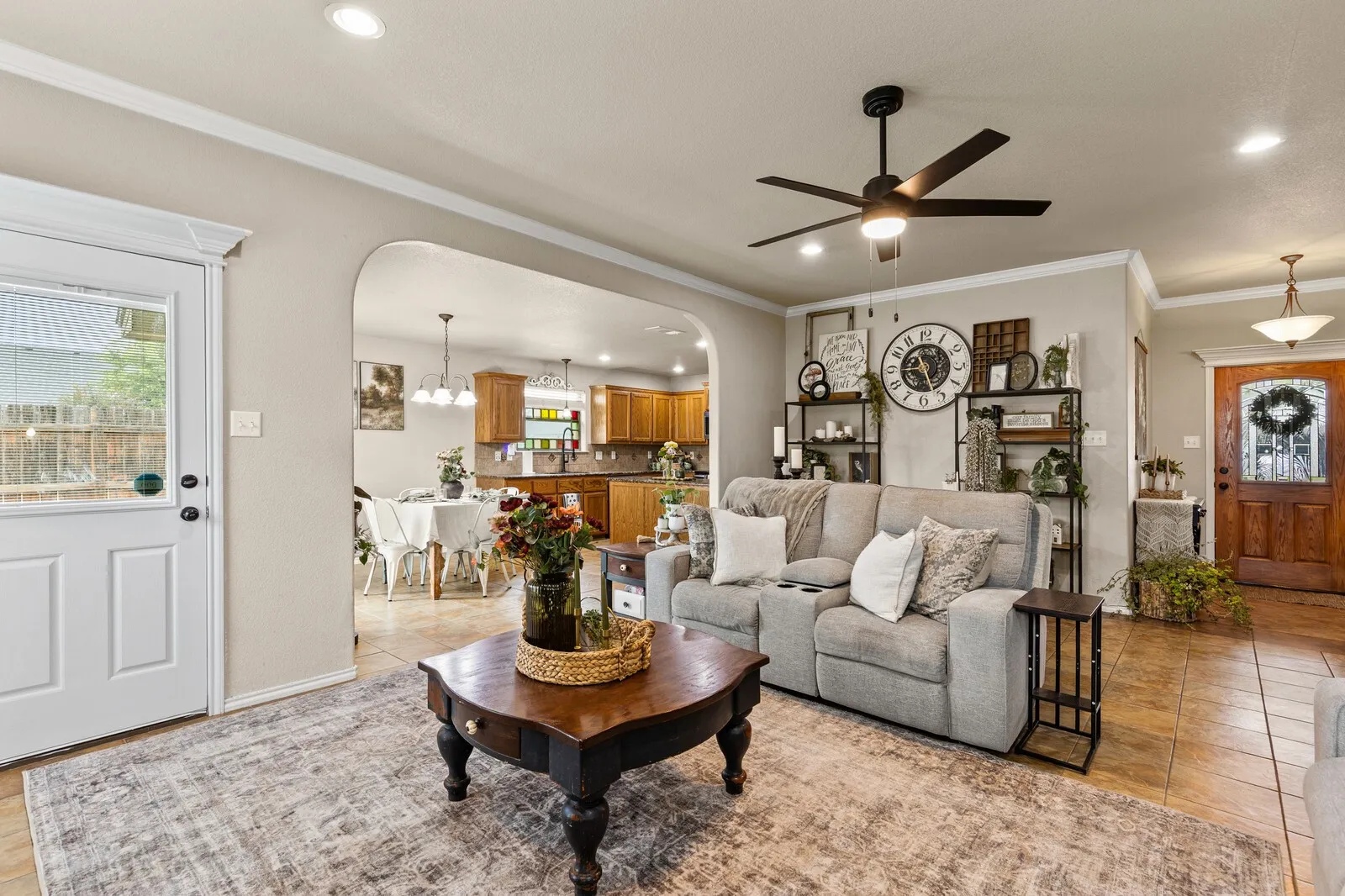 Living area featuring recessed lighting, a ceiling fan, and crown molding