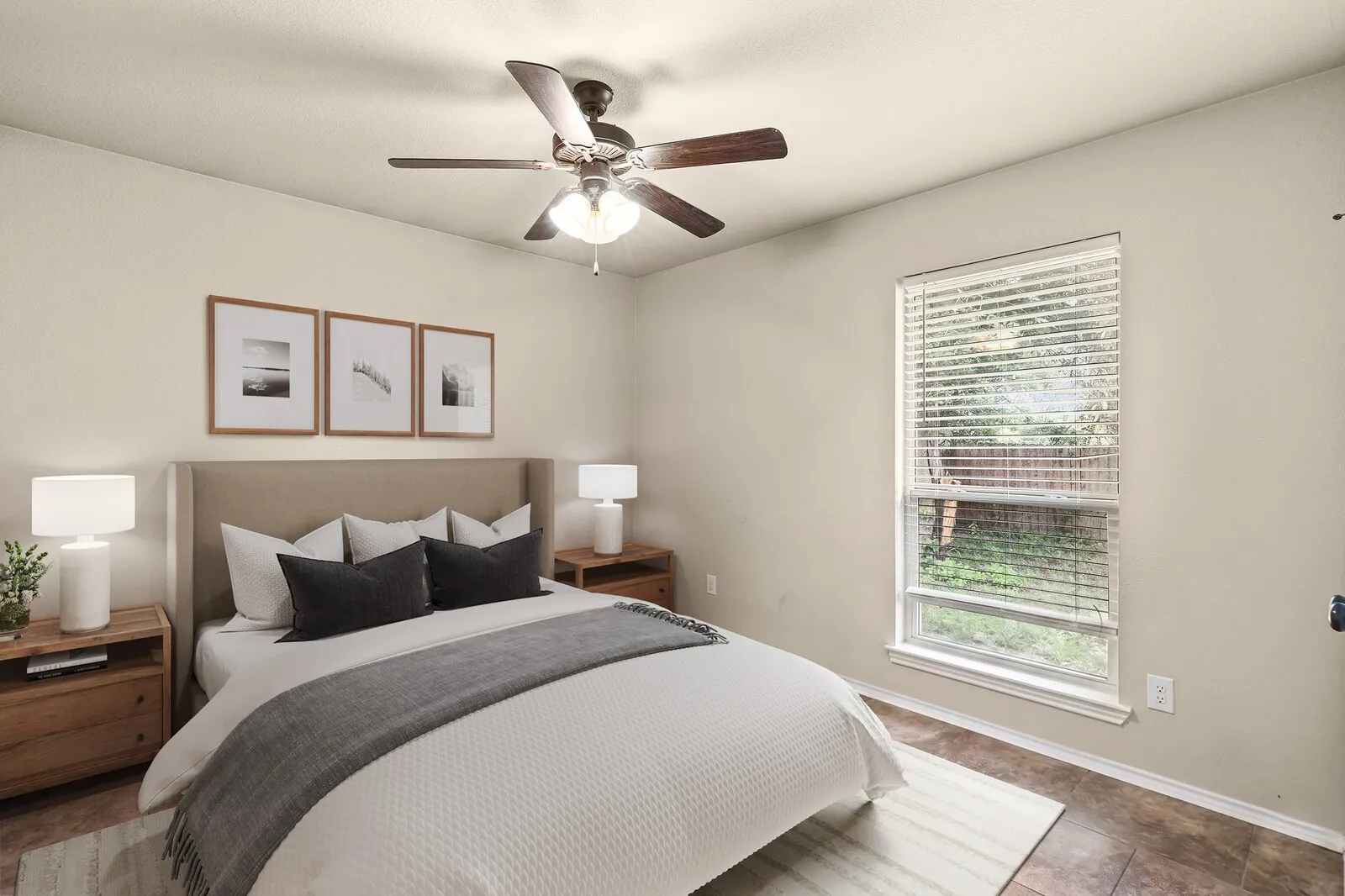 Bedroom featuring neutral wall color, overhead ceiling fan with light fixture, and wood-finish flooring. Digital Rendering