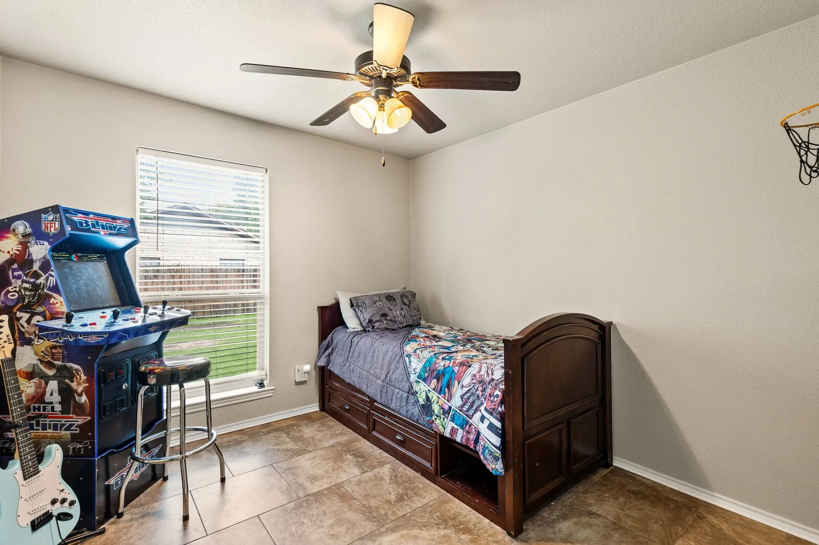 Bedroom featuring light neutral walls and tile flooring