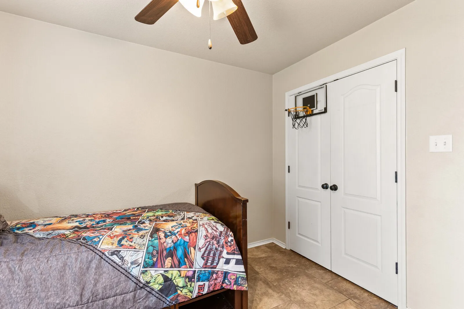 Neutral tone wall paint complements the light brown flooring