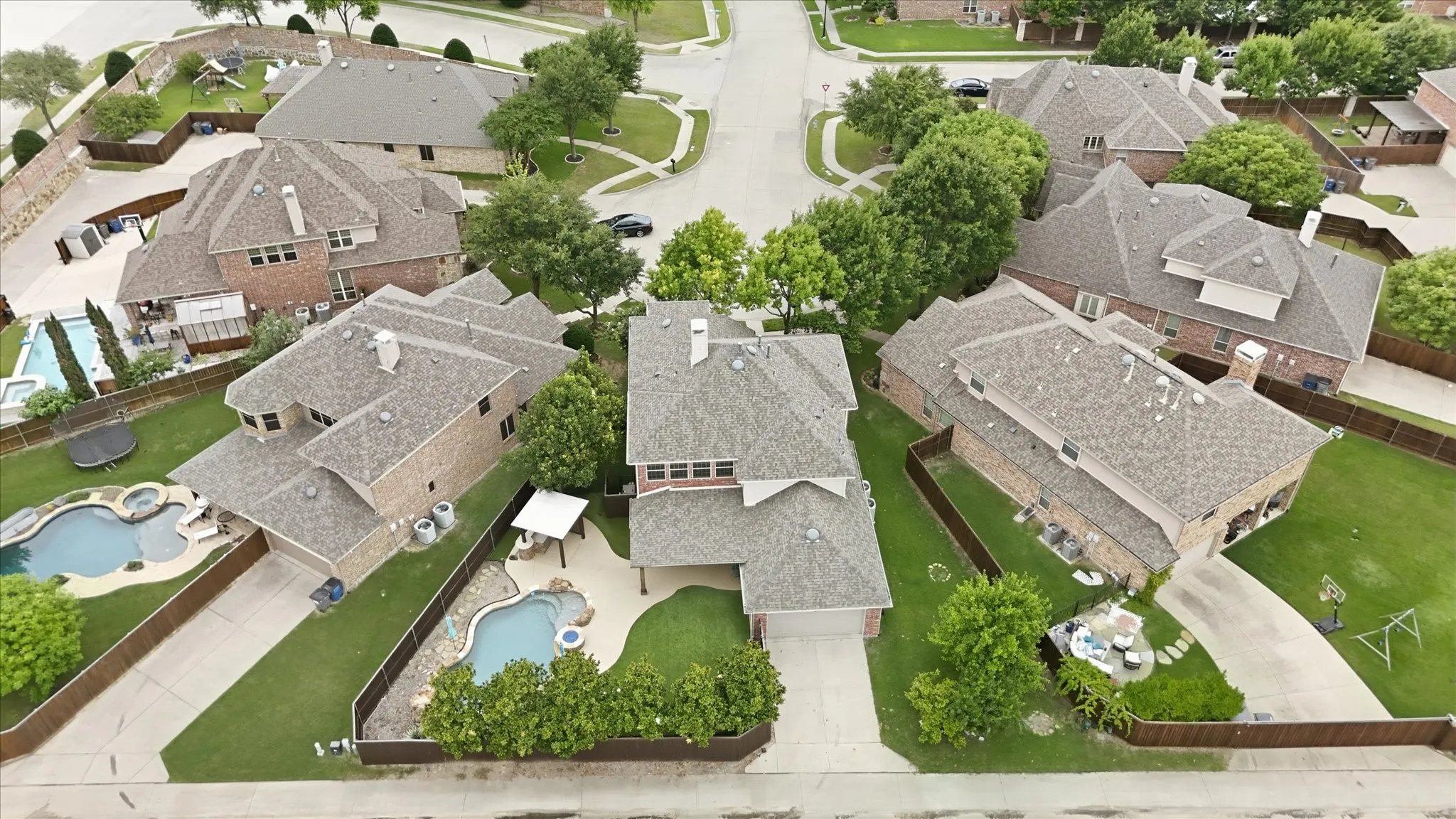 2253 Big Valley Circle, Allen, TX 75013 - Aerial View - Aerial perspective showcasing a residential property featuring a multi-gabled roof and a brick exterior