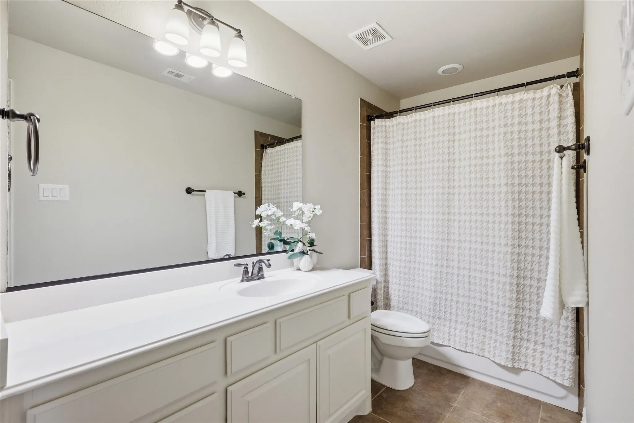 2253 Big Valley Circle, Allen, TX 75013 - bathroom - Bathroom featuring a white vanity with built-in cabinetry, a single sink, and a large wall-mounted mirror