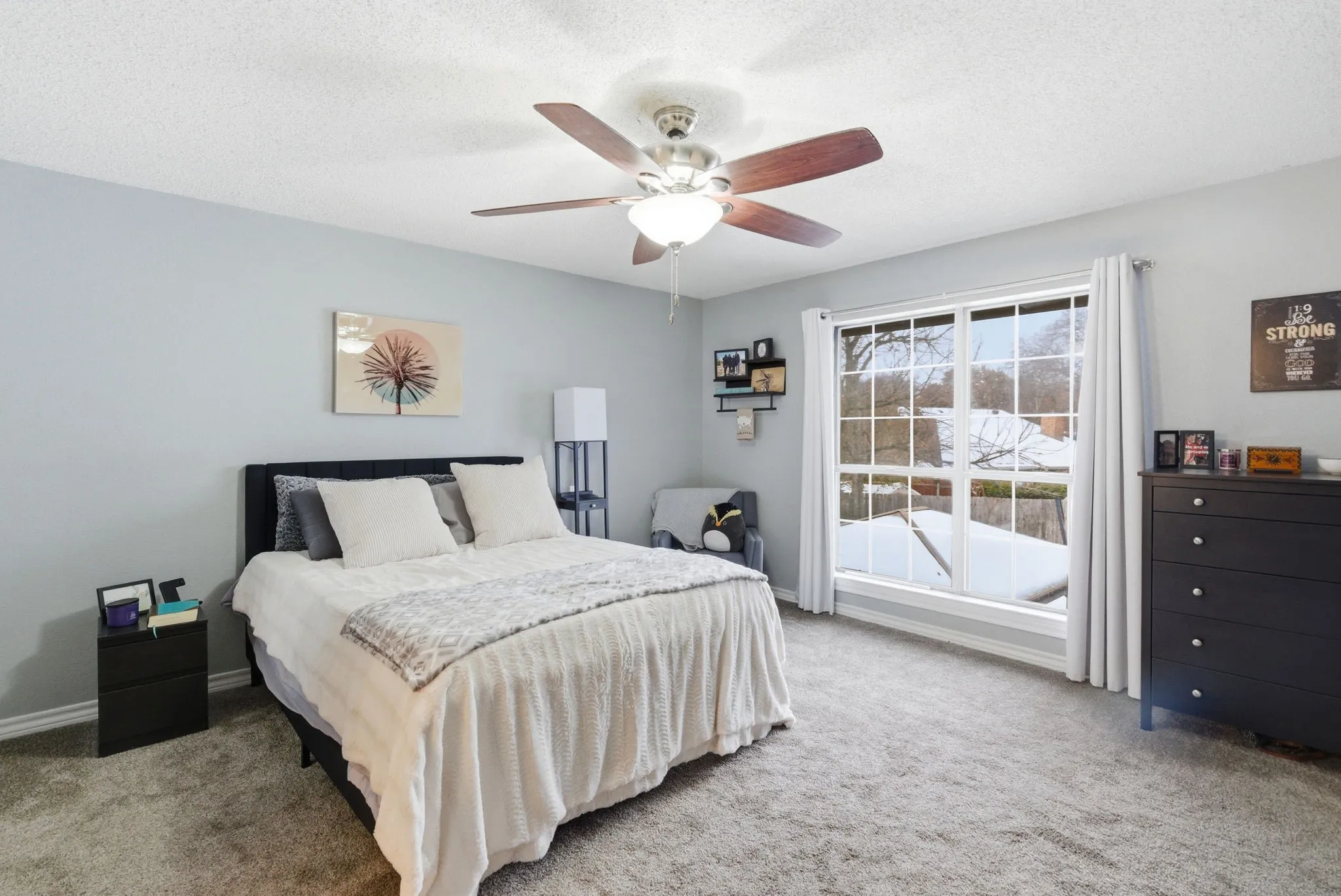 Bedroom featuring soft gray carpeting and light gray walls