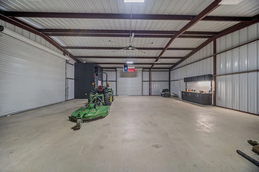 Spacious warehouse interior with high ceilings and exposed metal beam construction