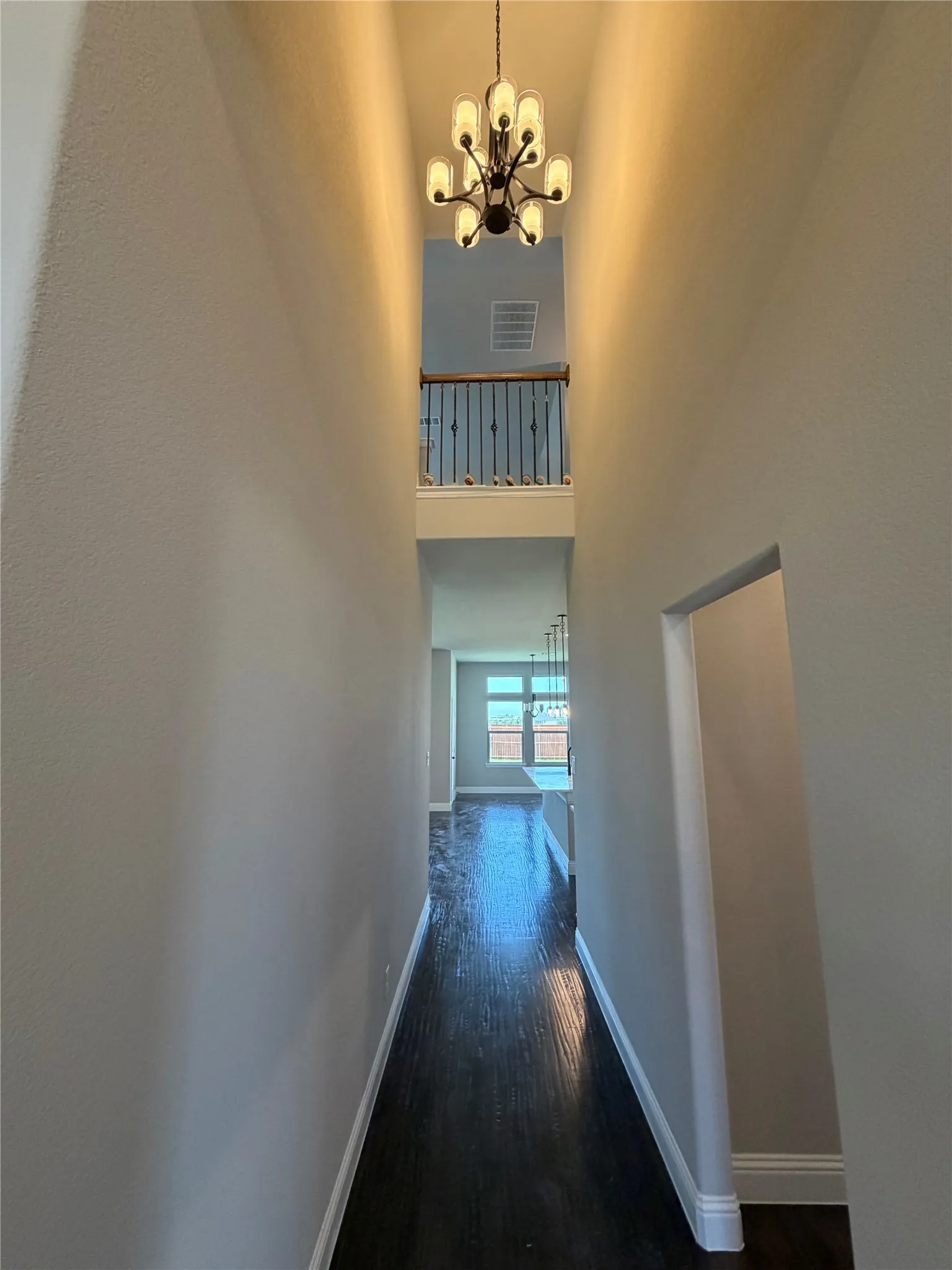 Matte black decorative chandelier in cathedral ceiling