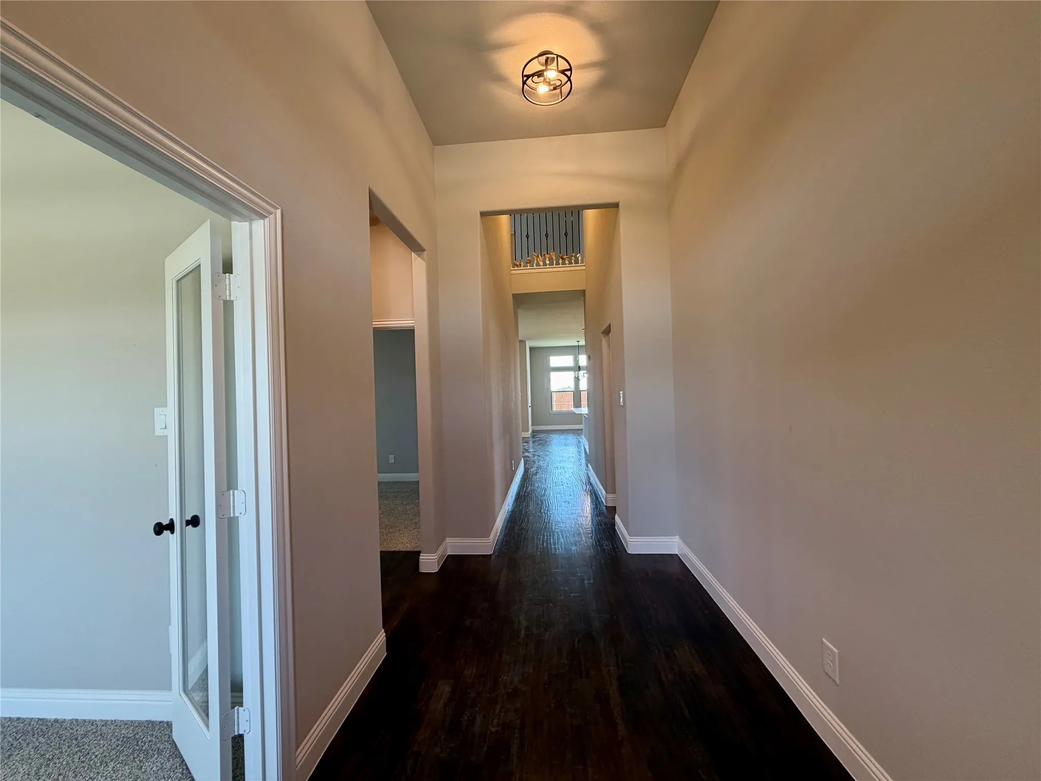 REAL Ebony hardwood floors in entry, kitchen, cafe & family
