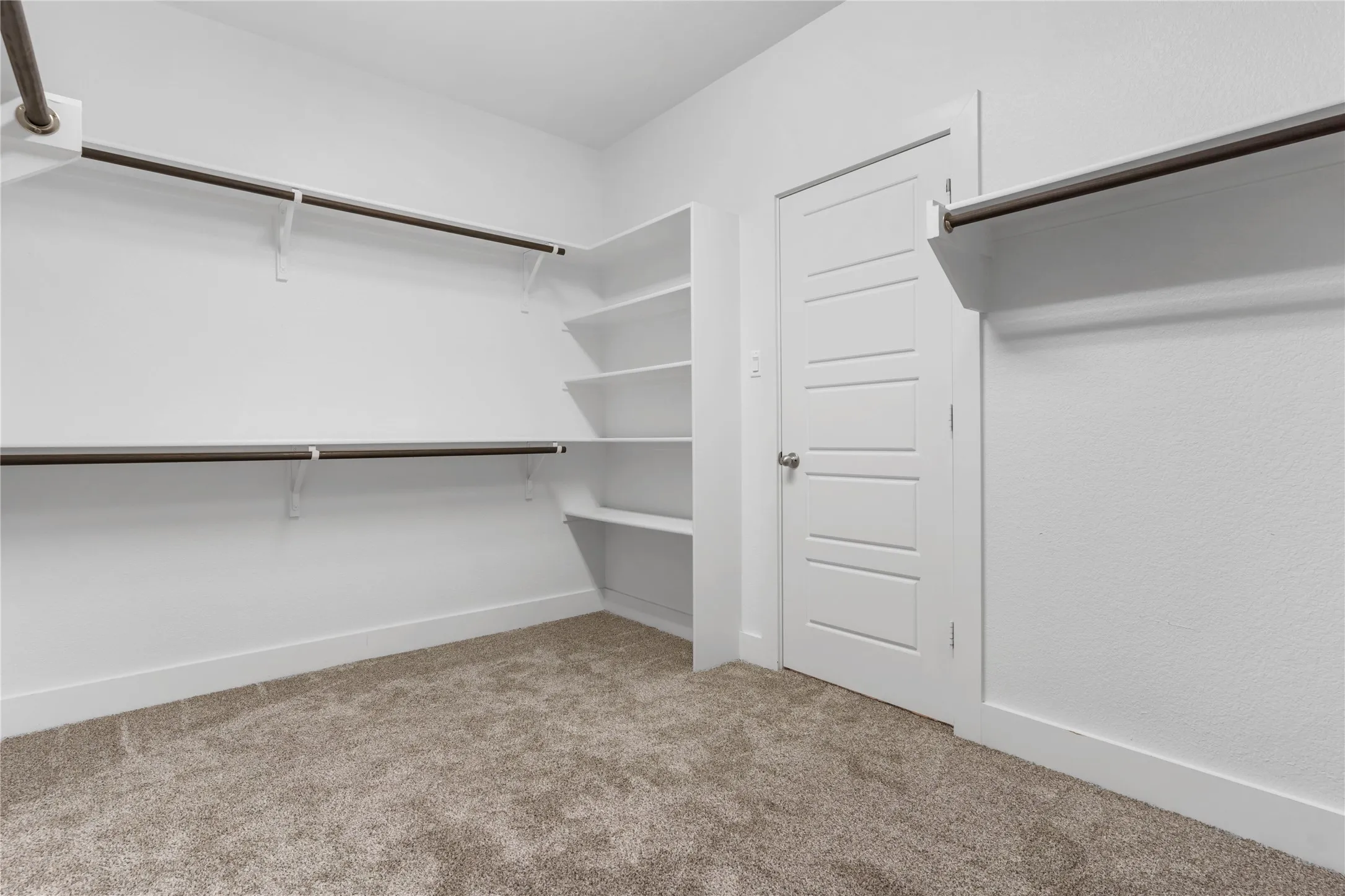 Master Closet w/ door leading to Laundry Room