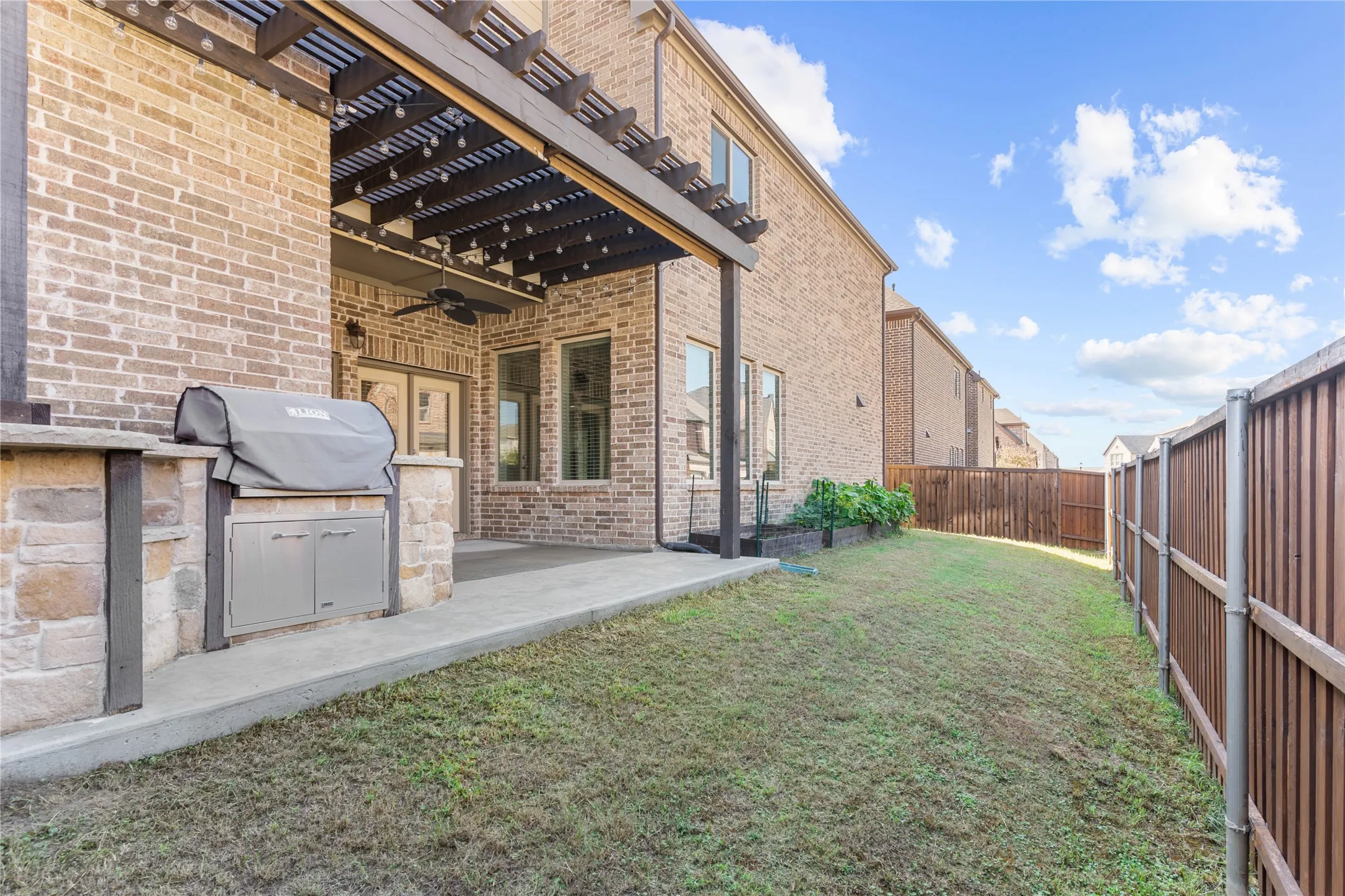 Side yard, privacy fence, garden beds