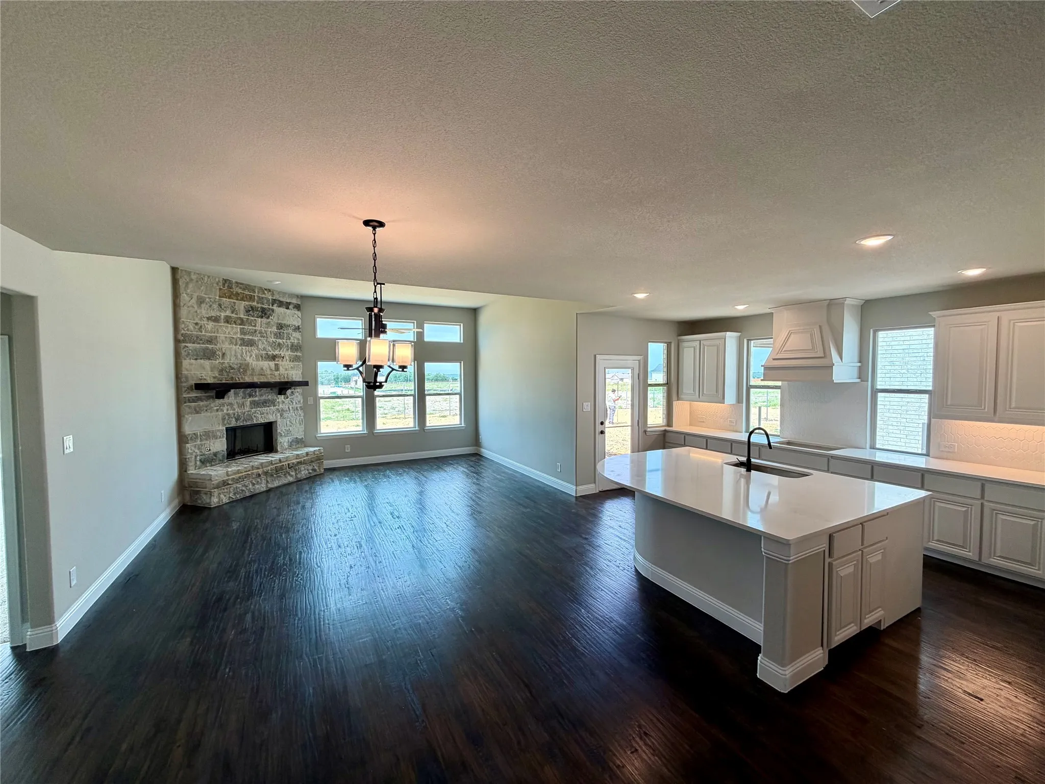 REAL ebony stained hardwoods in entry, kitchen, cafe, and family room
