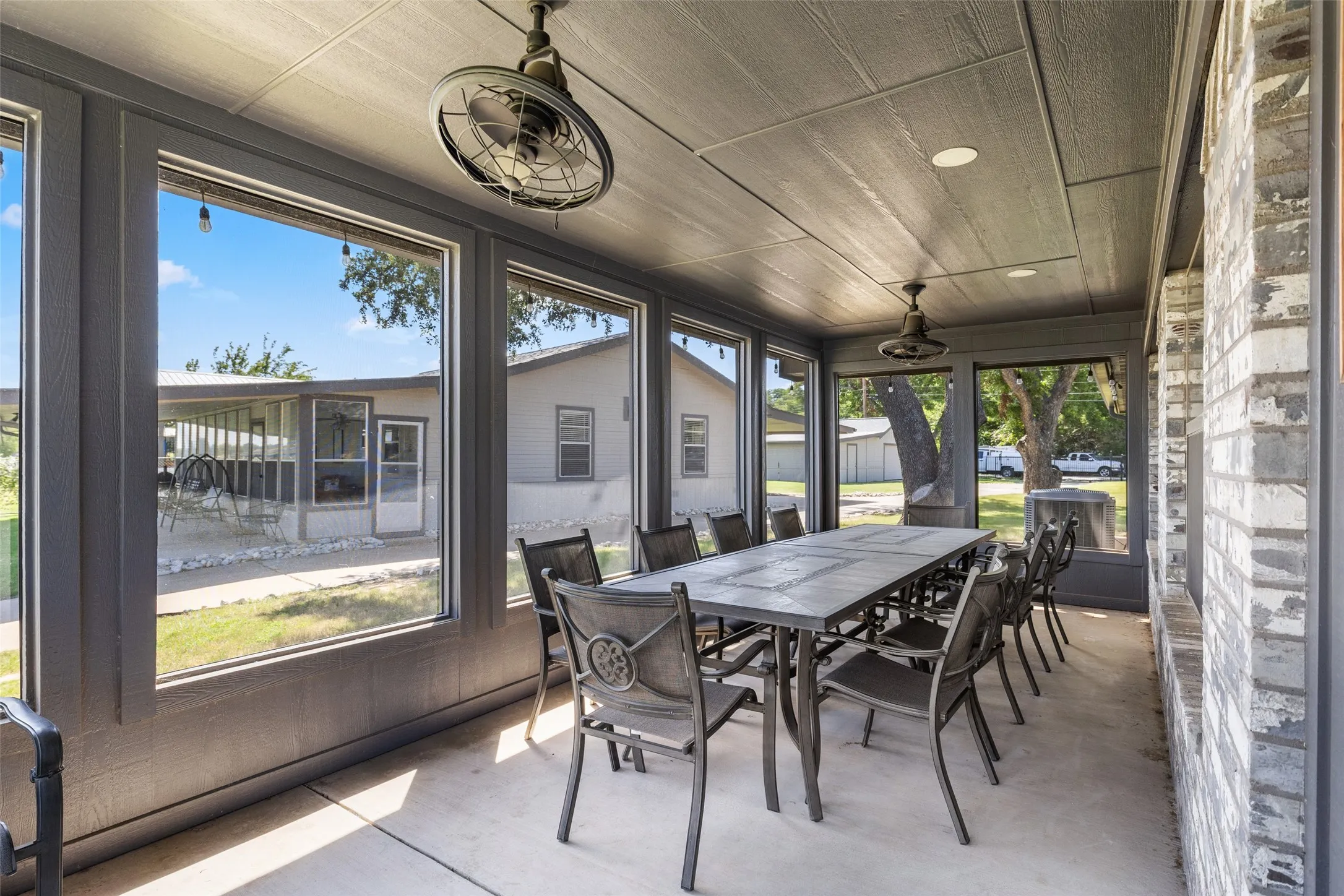 screened in porch with fans