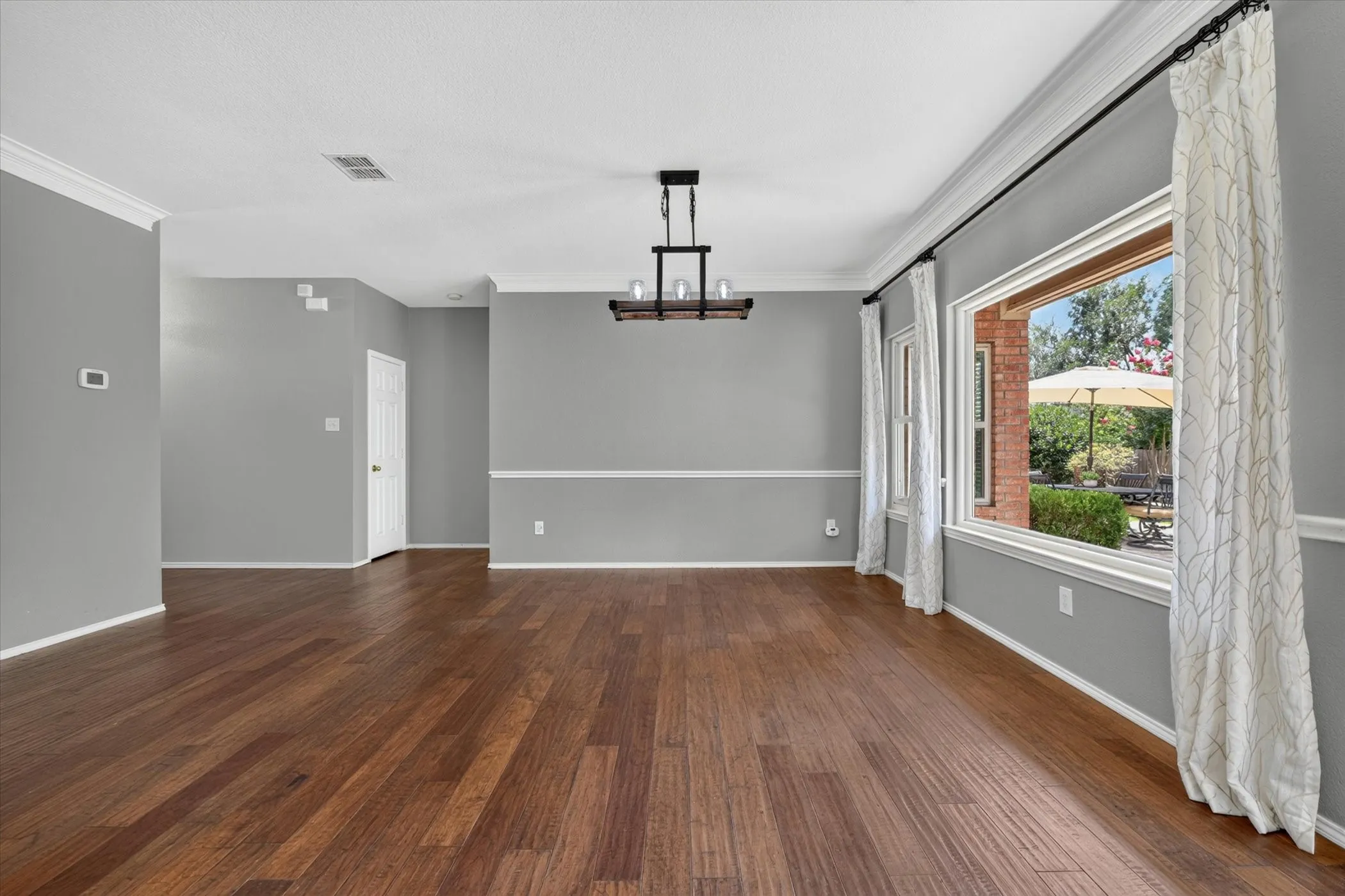 The giant picture windows give you a glorious view to the back yard