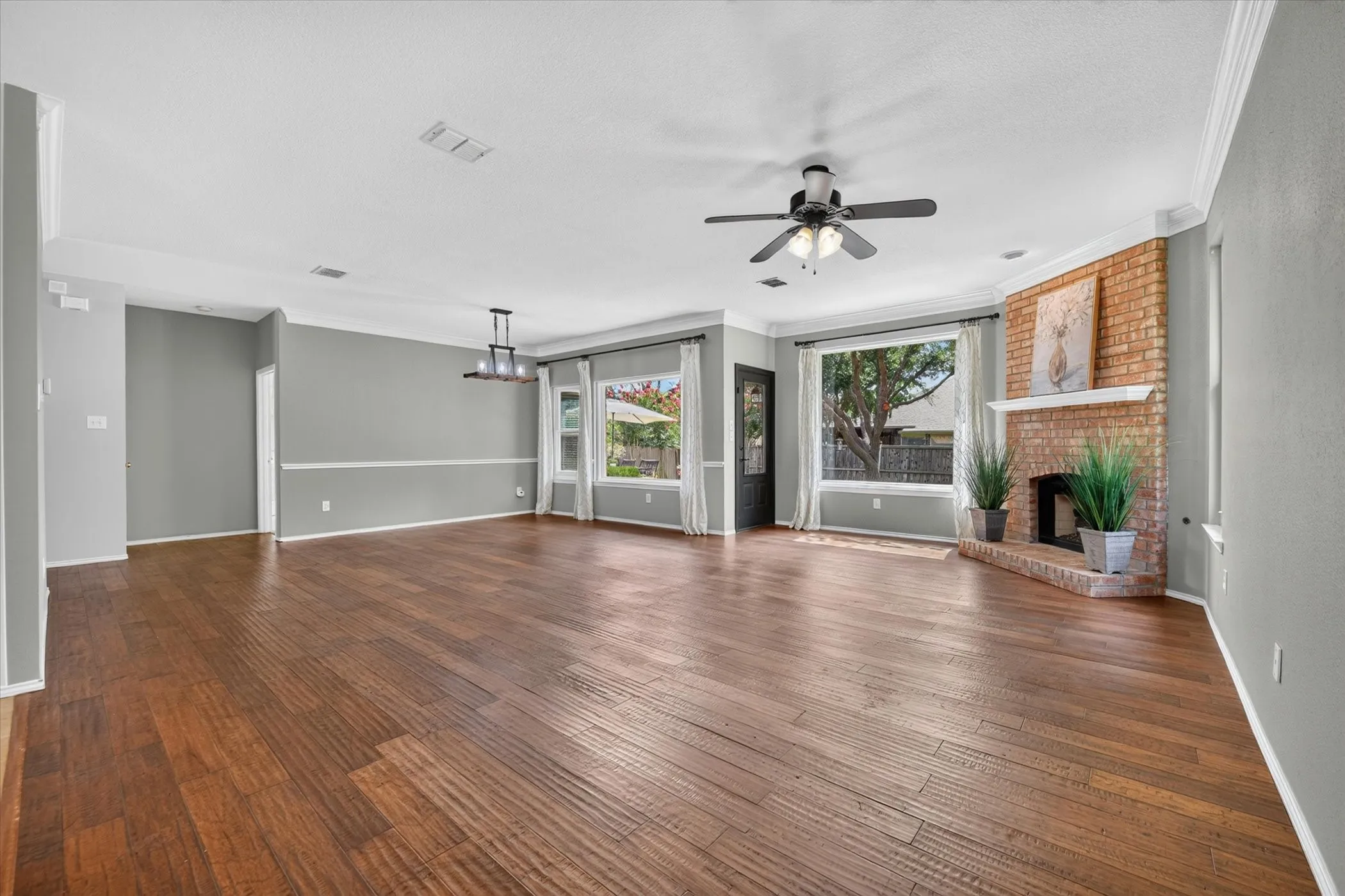 Another view of the dining and living areas and the picture windows