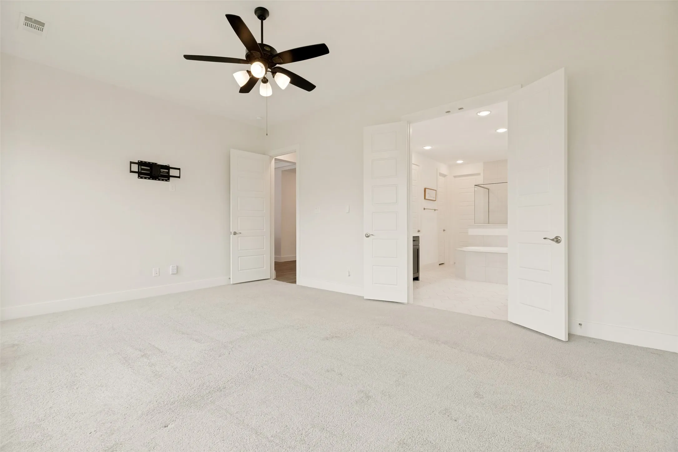 french doors into primary bathroom