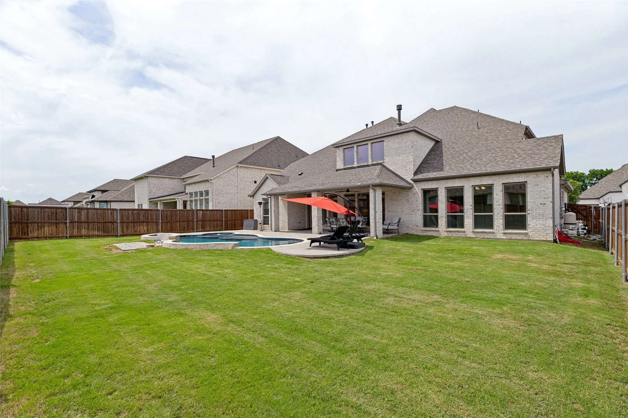 Large grassy area in backyard