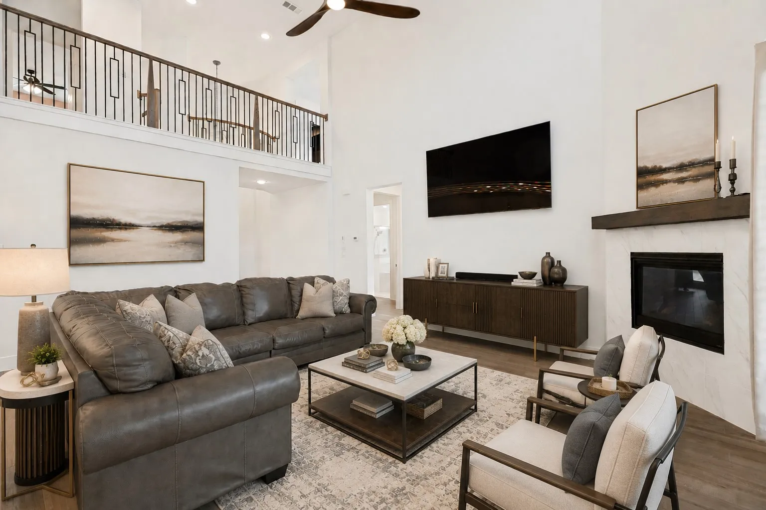 large 2 story living area that opens to kitchen