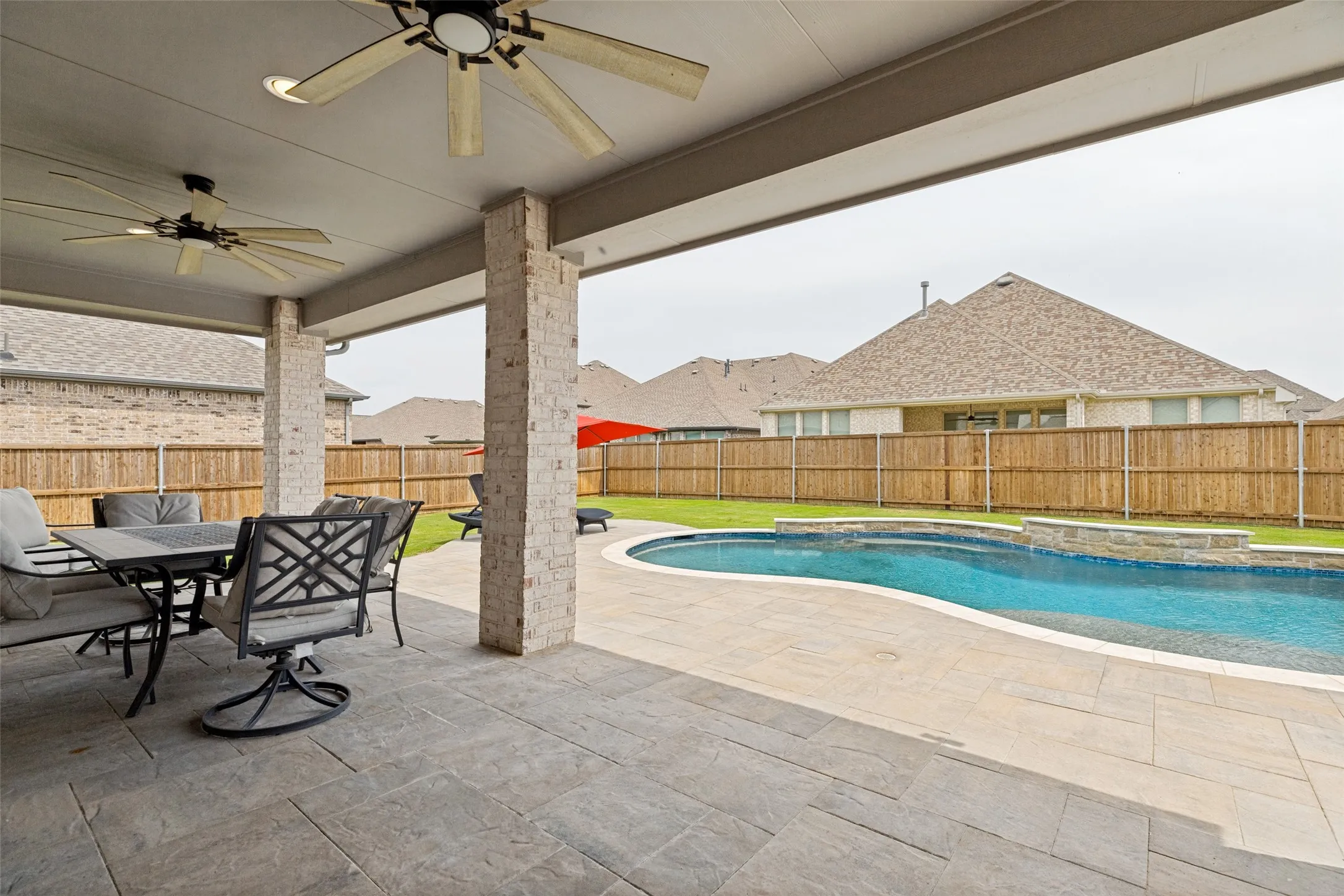 Extended cover patio with non-slip stamped pavers