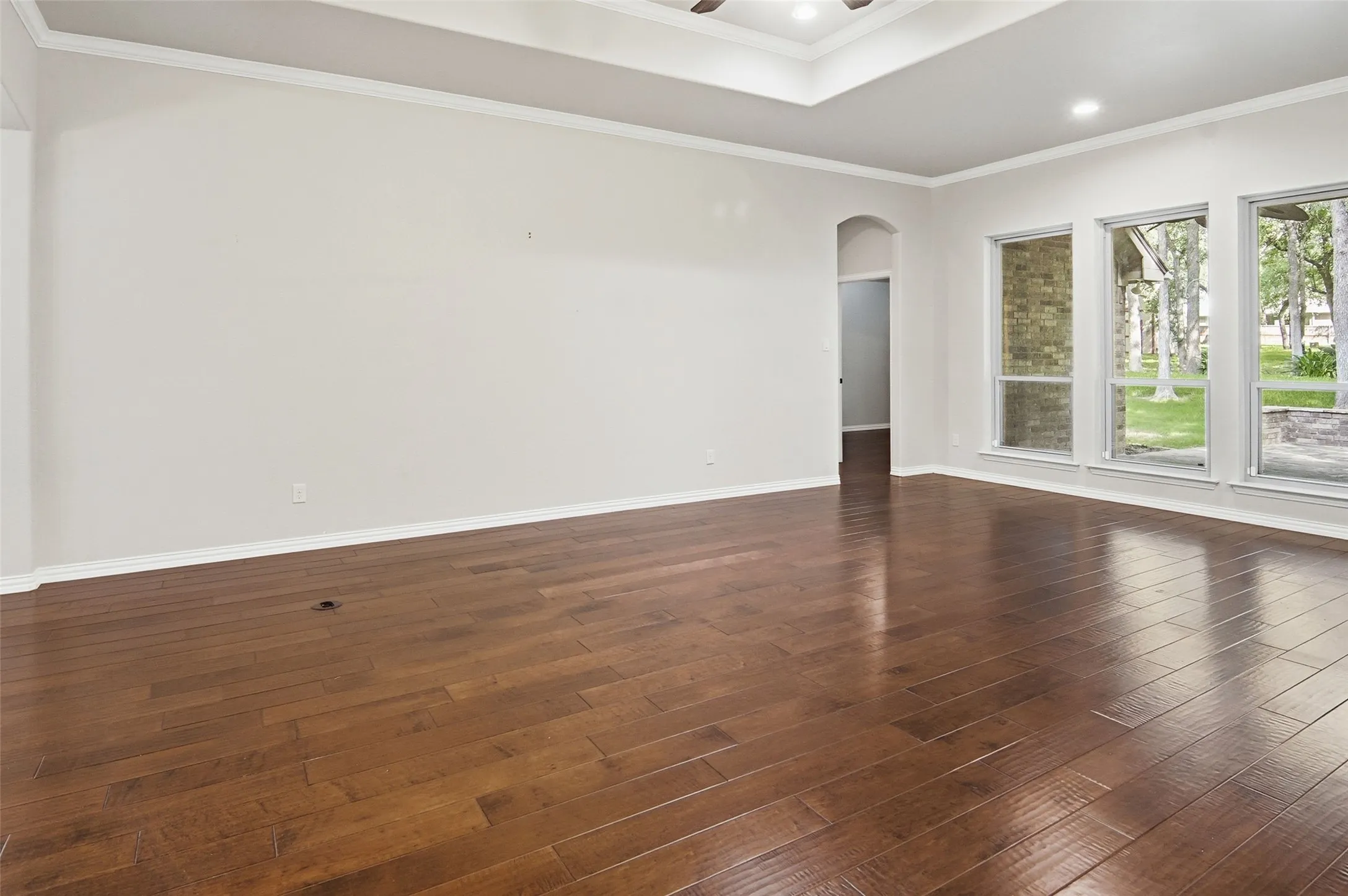 living room with crown molding, spectacular ceiling treatment