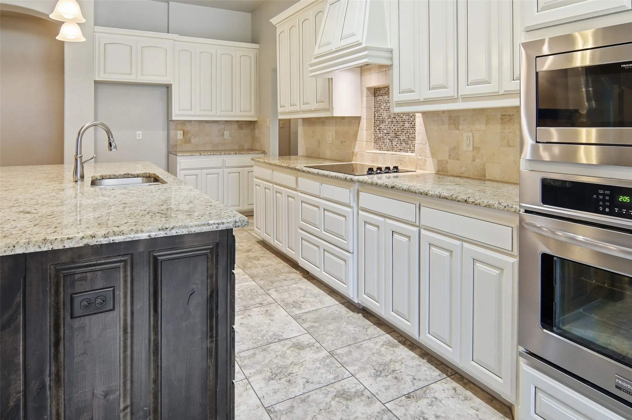 tile floors, stainless steel appliances, beautiful back splash