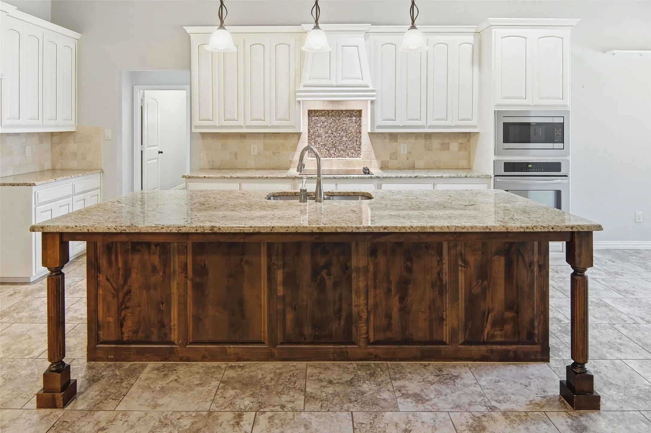 kitchen with amazing island, breakfast bar, granite tops
