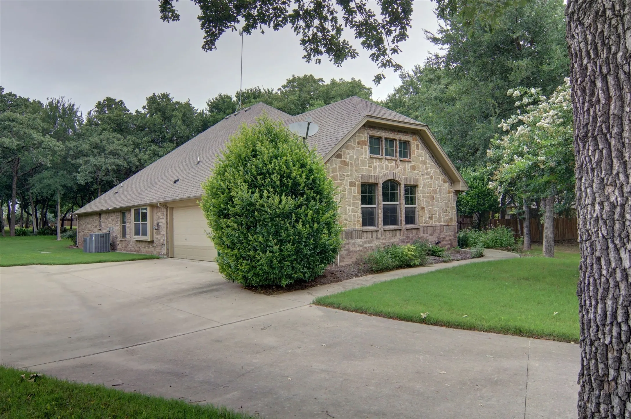 3 car side garage with excellent driveway
