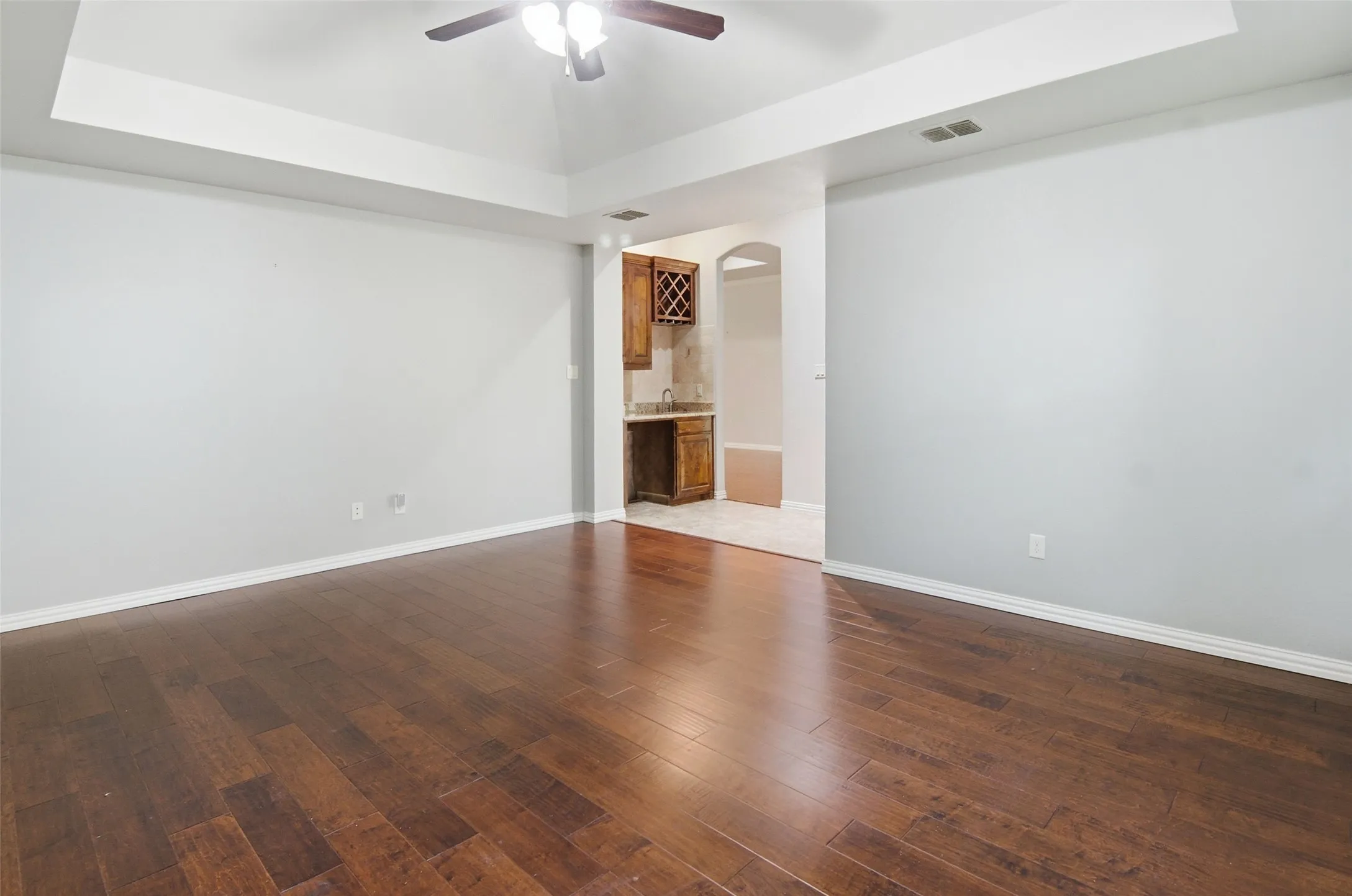 game room has a wet bar for convenience.