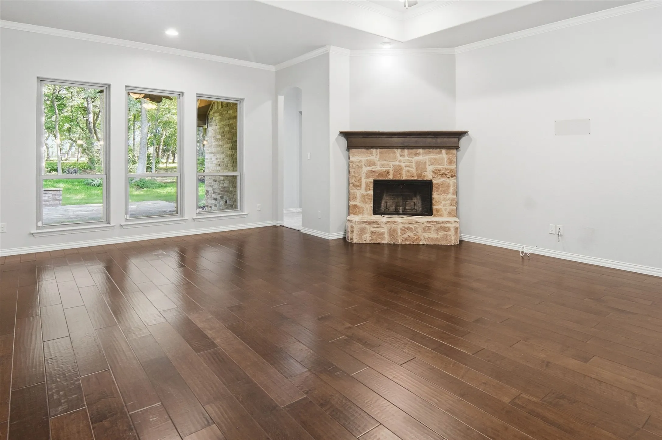 spacious living room, wonderful view, and wood burning stone fireplace