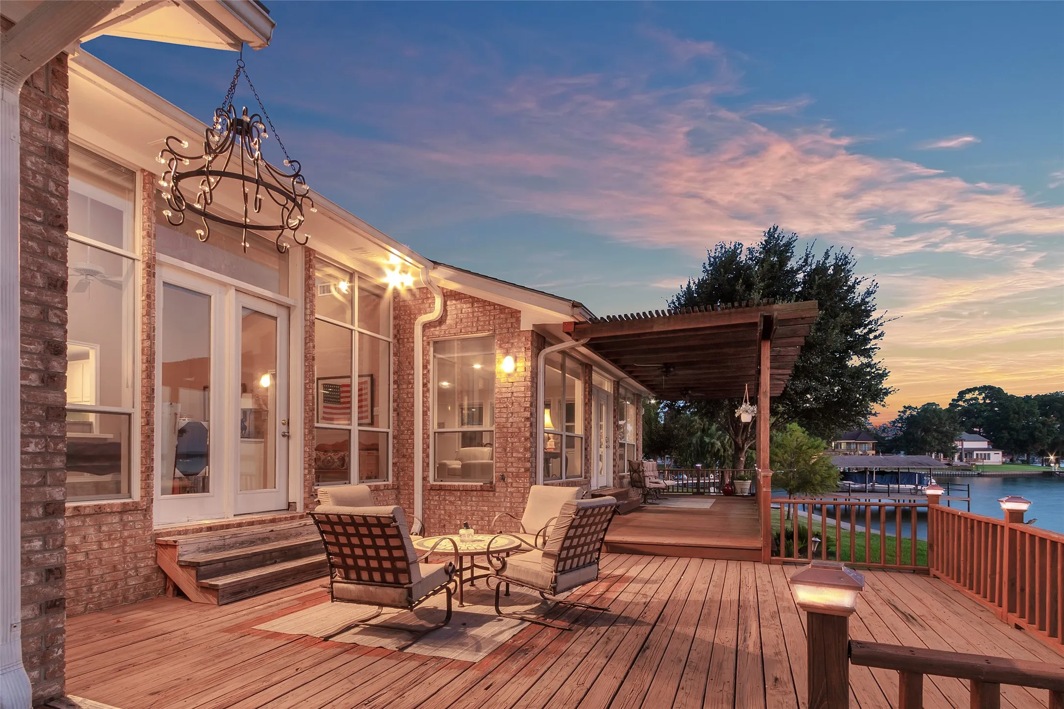 View of deck and pergola at dusk