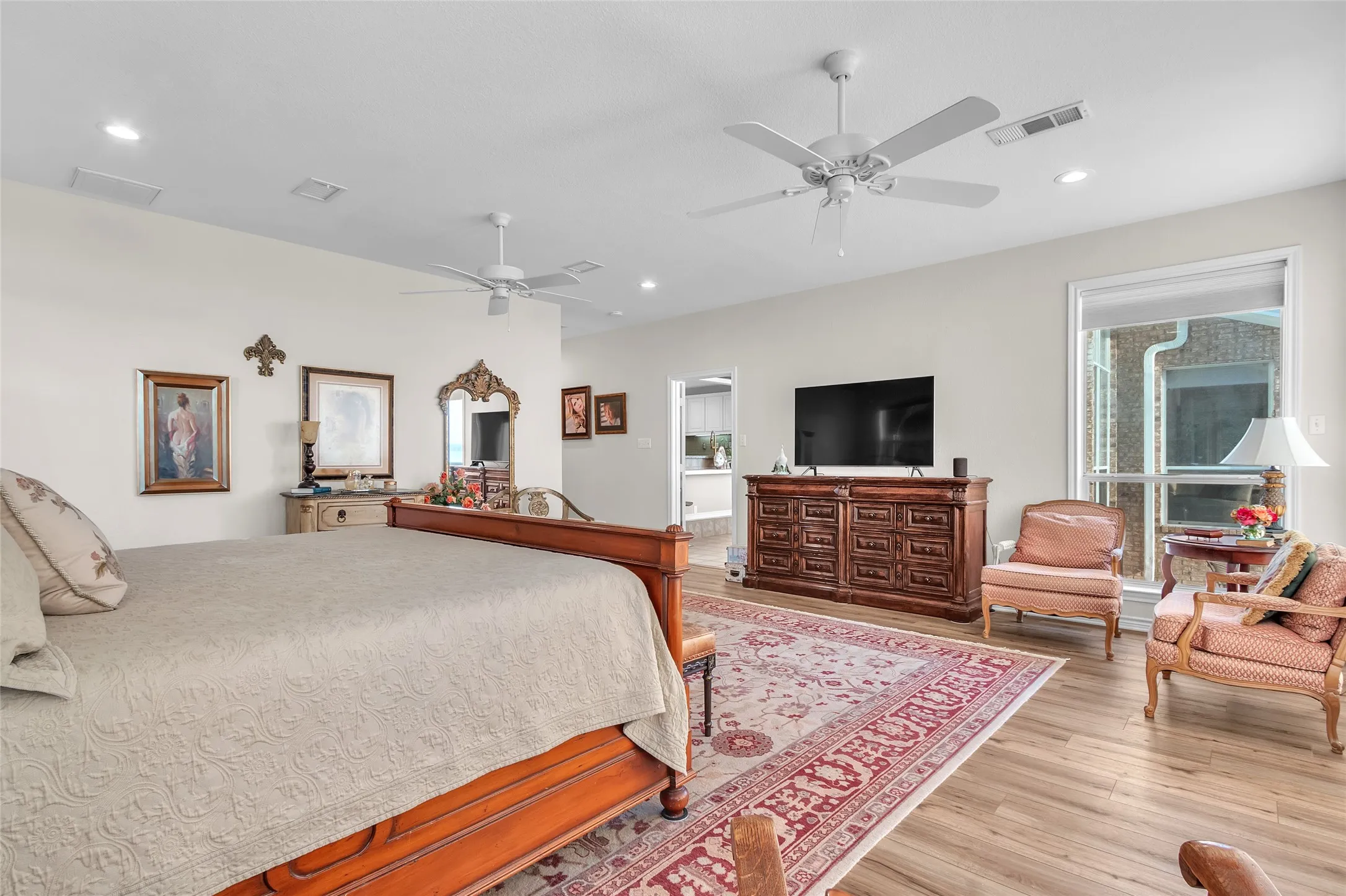 Tall ceilings and lots of windows and water views all around create a peaceful retreat with sitting area and beautiful sunset views