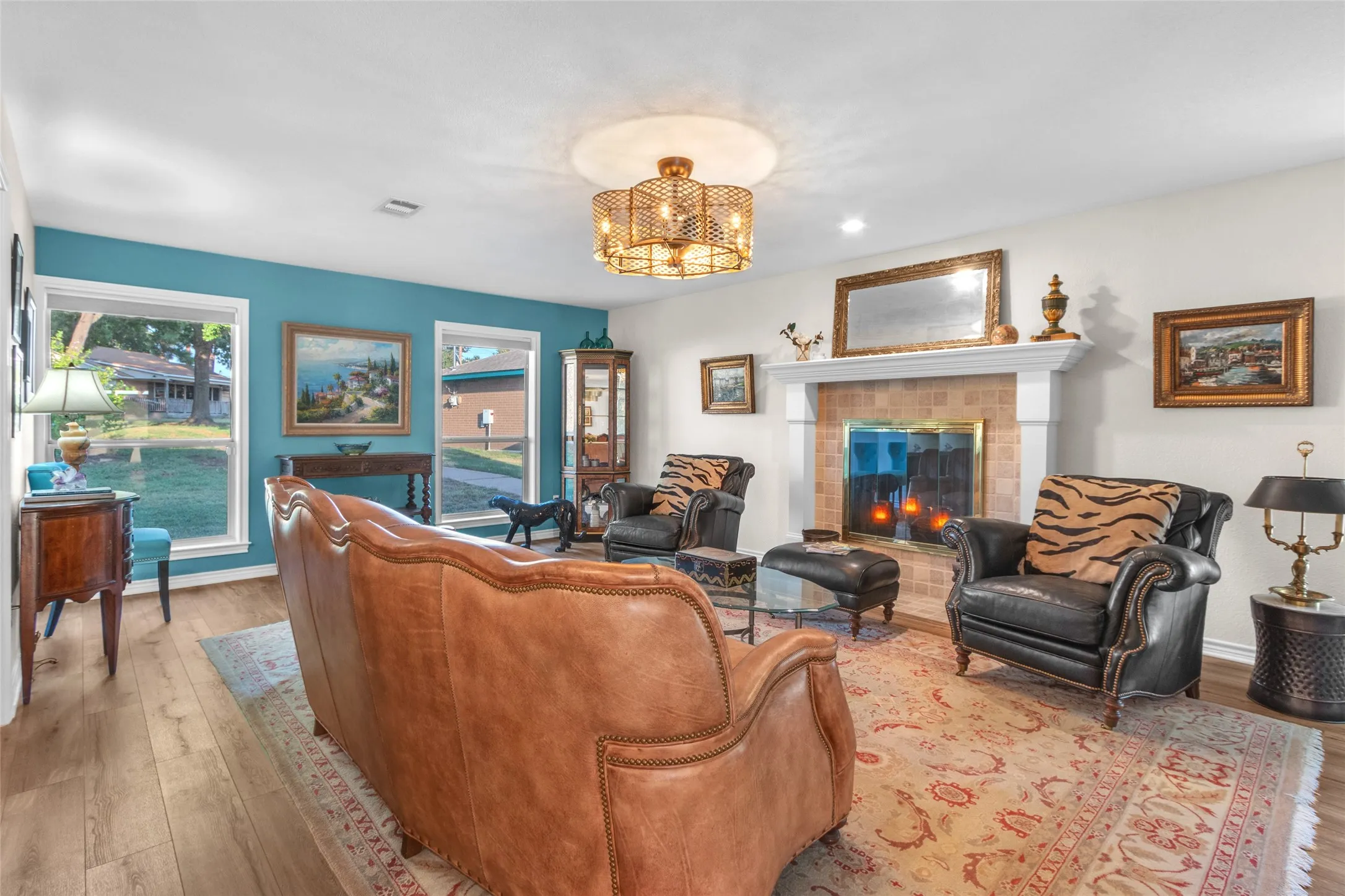 New LED can lighting, light with ceiling fan enclosed, wood burning fireplace, open to dining, living and study