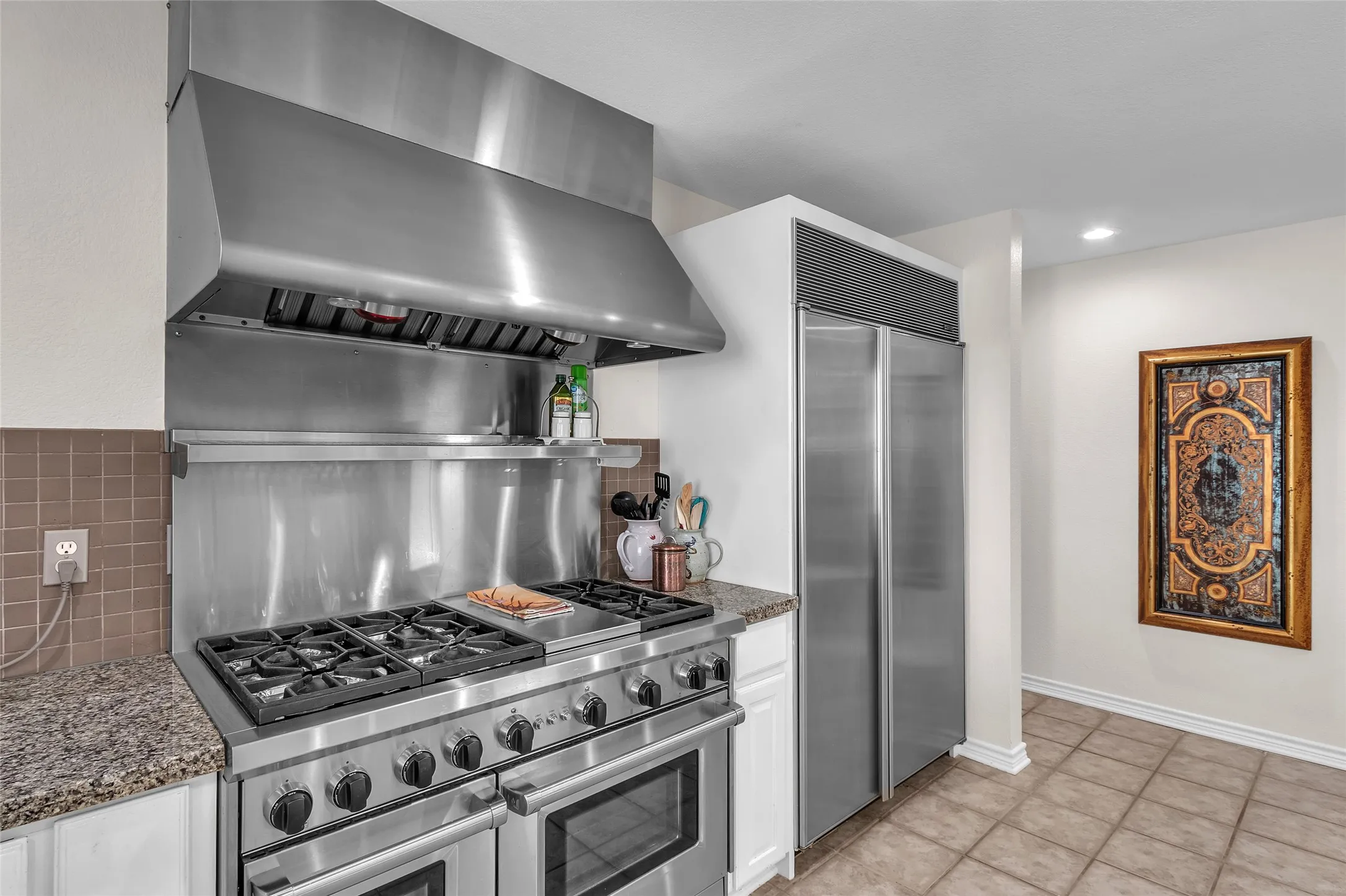 6-Burner Wolfe gas range and Sub Zero fridge
