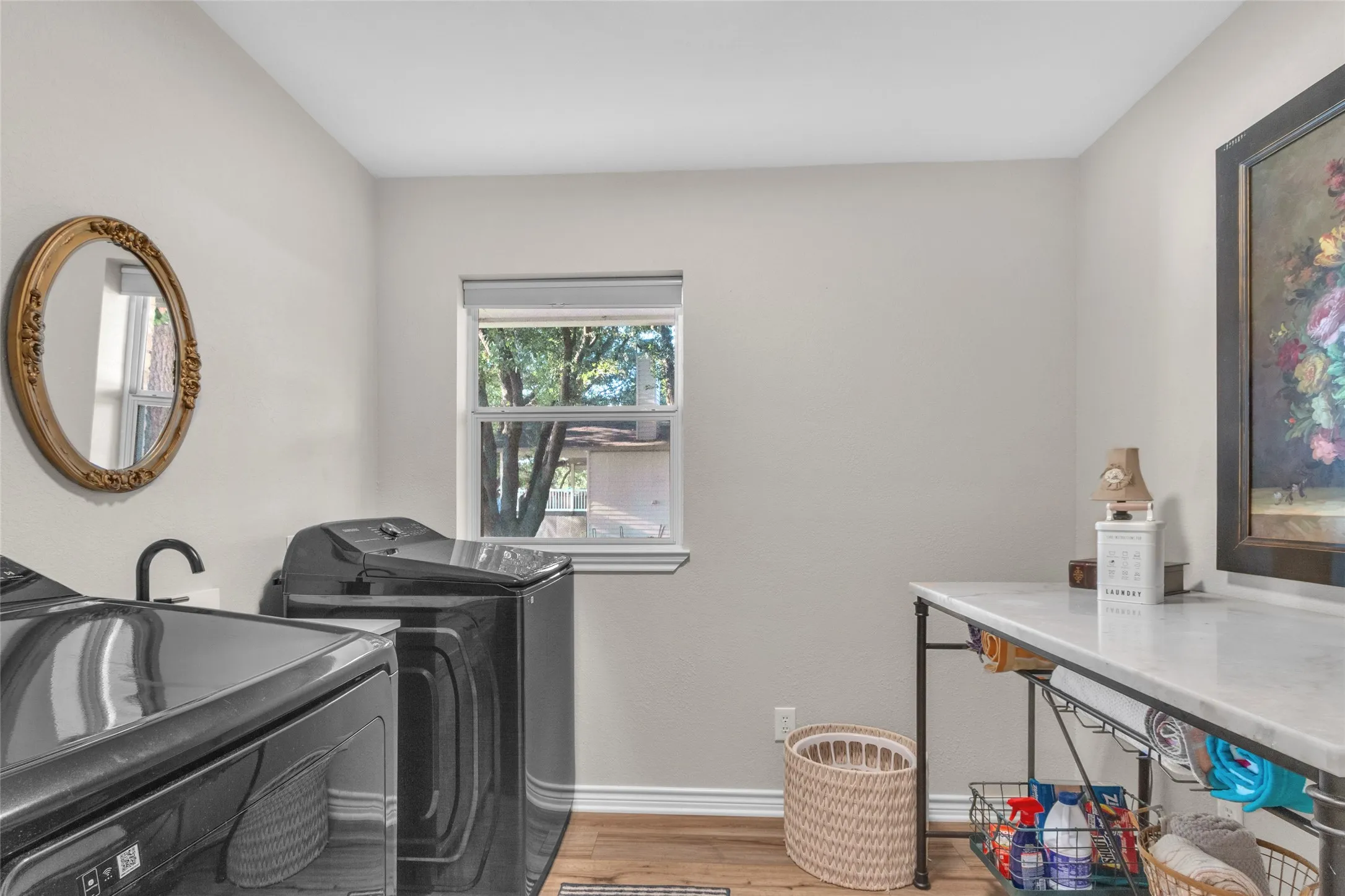 New laundry room with sink and lots of room for folding