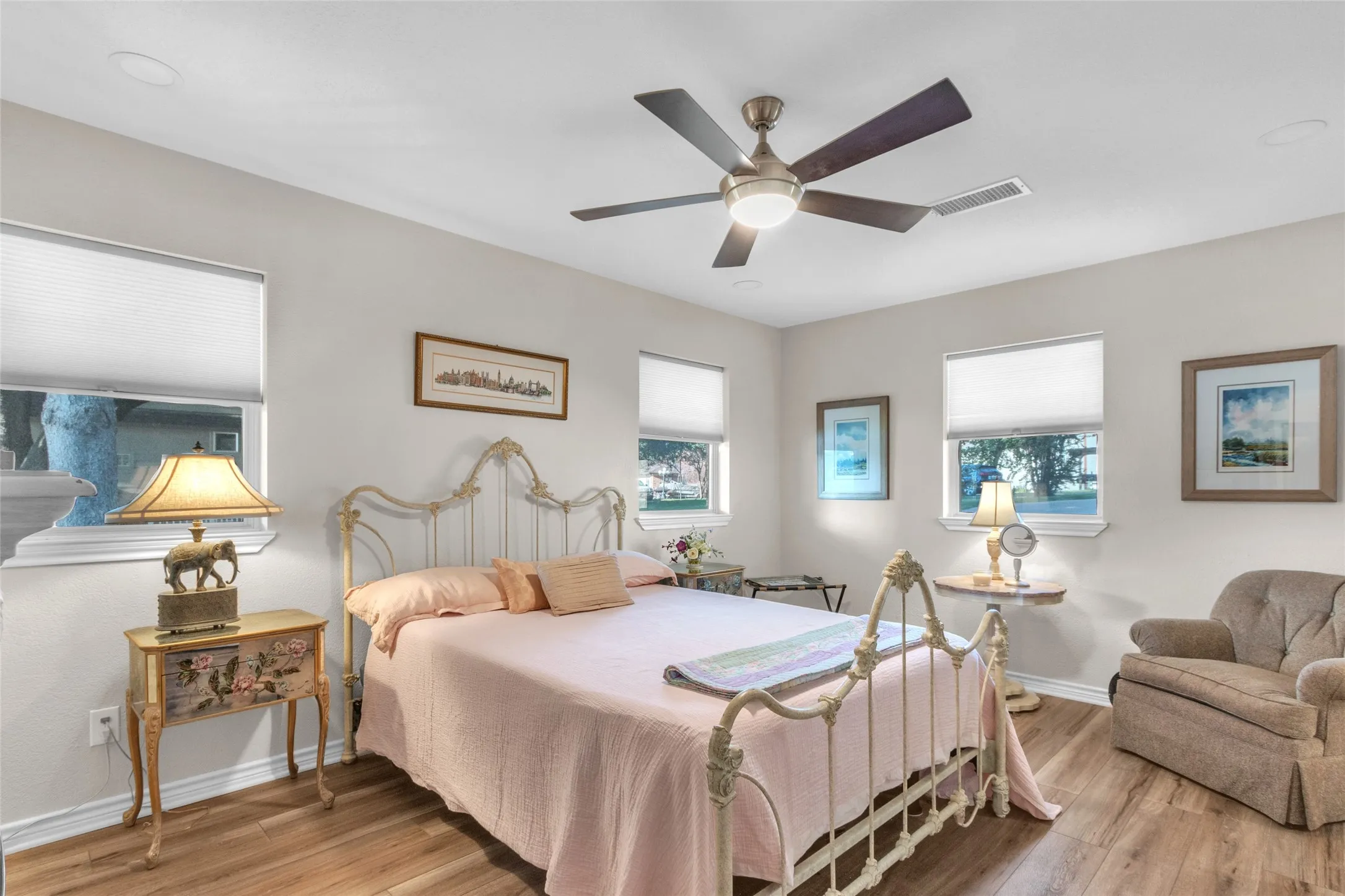 Bedroom 2 has an electric fireplace, lots of natural light, a waterview and an adjoining bath