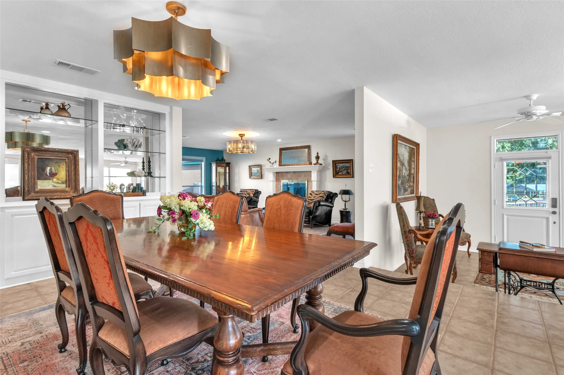 Main Dining Area with beautiful built-ins and a designer chandelier star feature