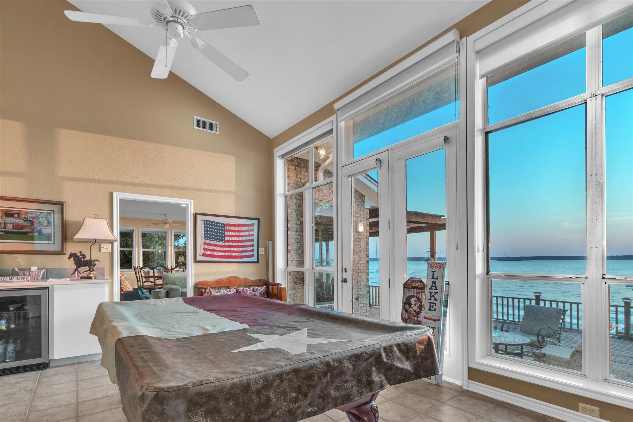 Tall ceilings, open views, built-ins with a mini-fridge and a serving-dining bar from the Kitchen for the picture perfect game room or could be additional dining, sunroom