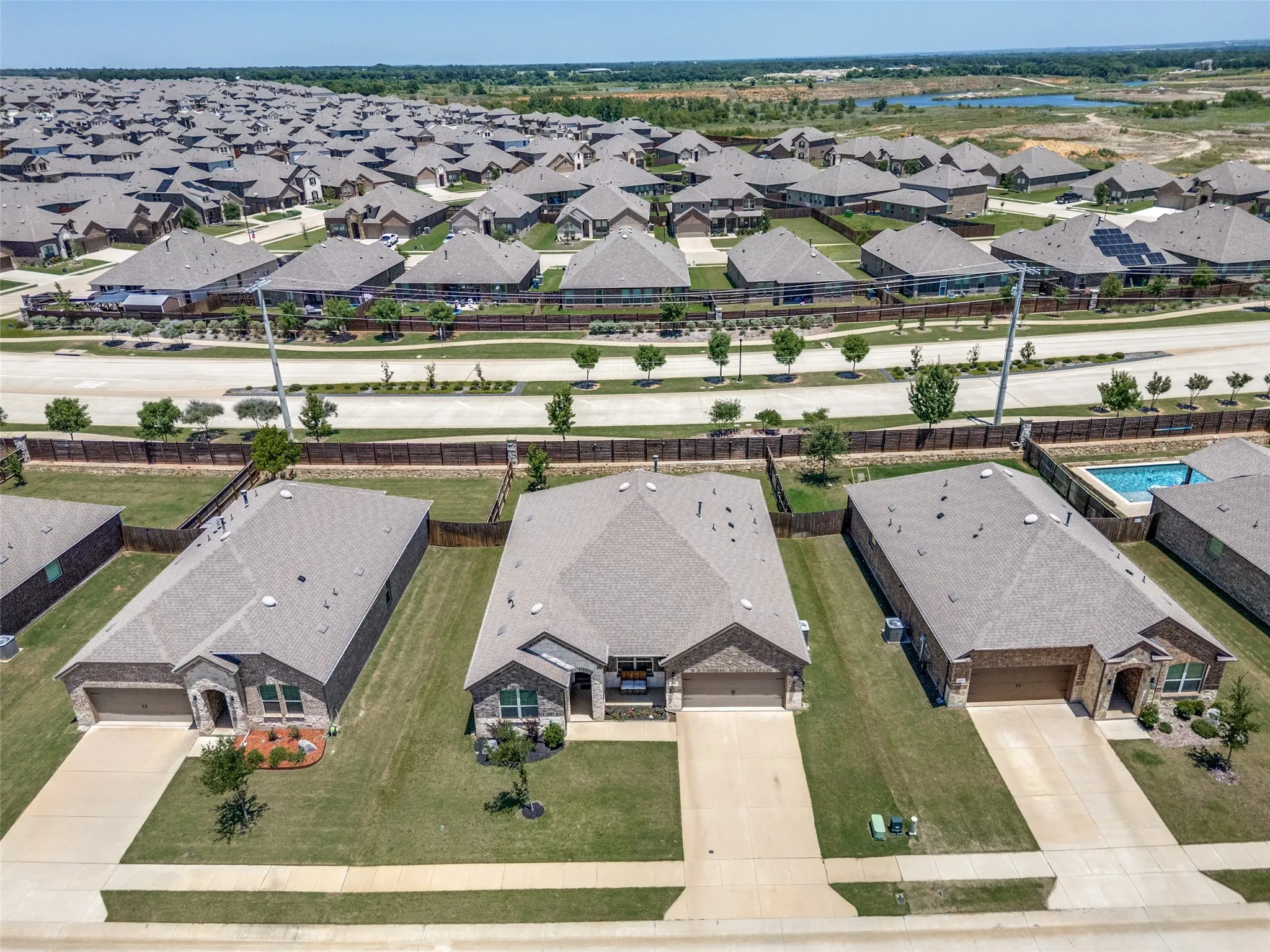 Aerial perspective showcasing a residential community with uniform architectural styles