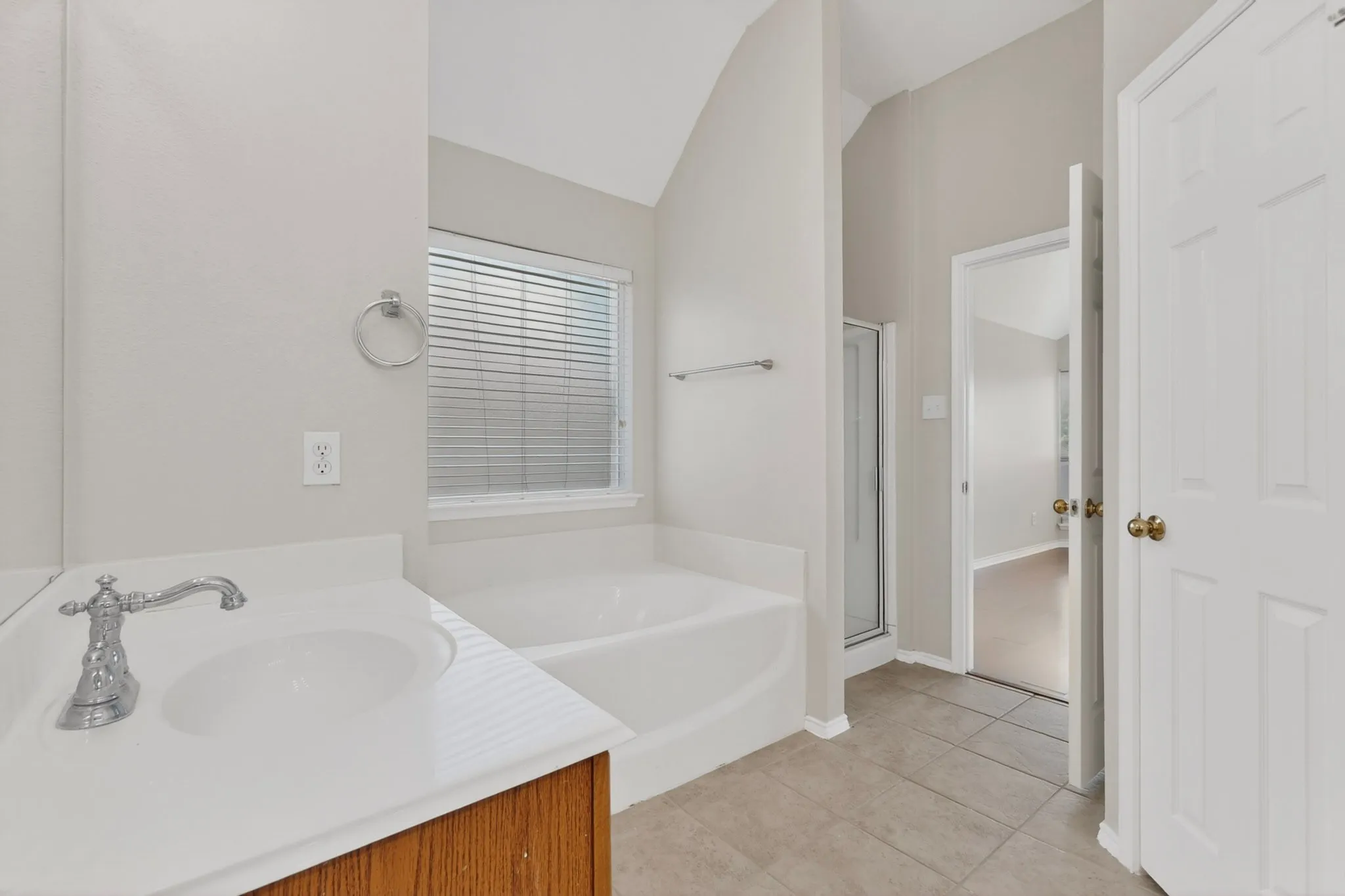 Bathroom vanity with an integrated sink and chrome faucet