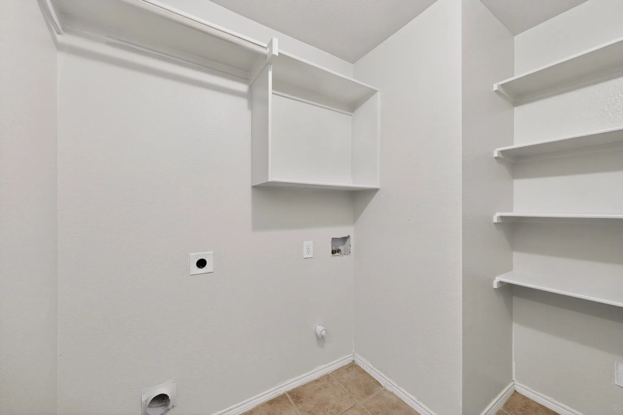 Dedicated utility space featuring a neutral color palette