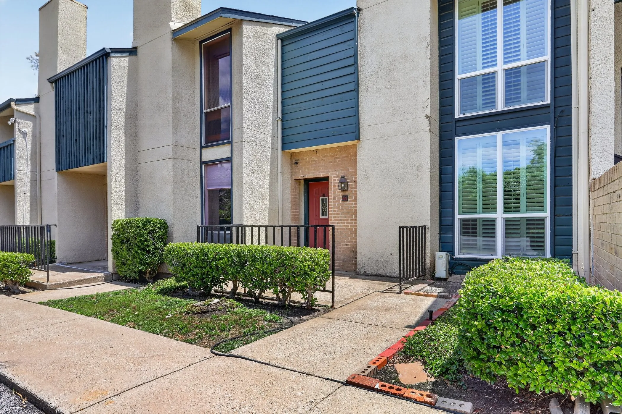 Contemporary exterior featuring stucco and horizontal siding accents