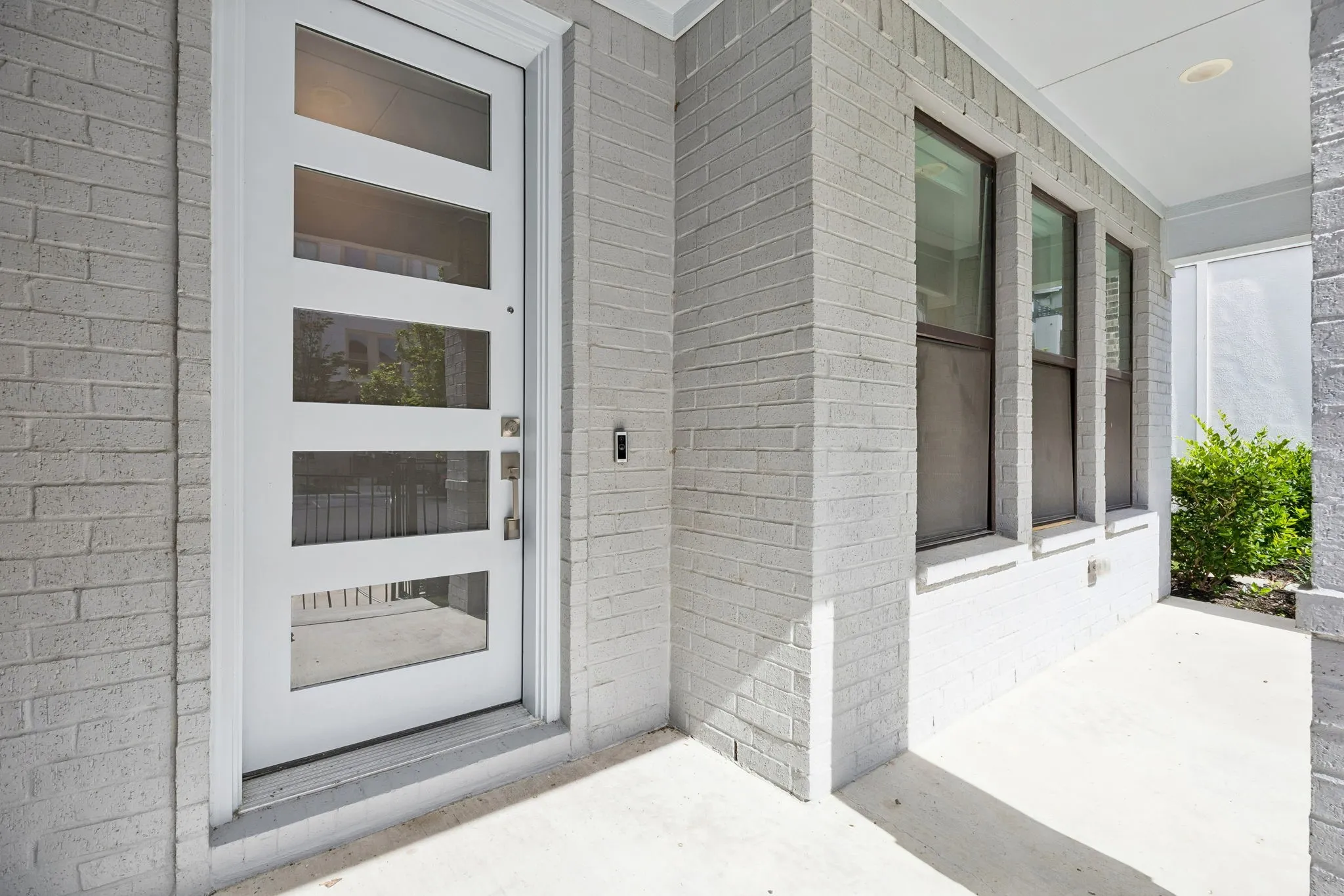 Contemporary Curb Appeal from the Moment You Arrive
The covered front porch and modern architectural design create a welcoming first impression and an inviting entry experience.