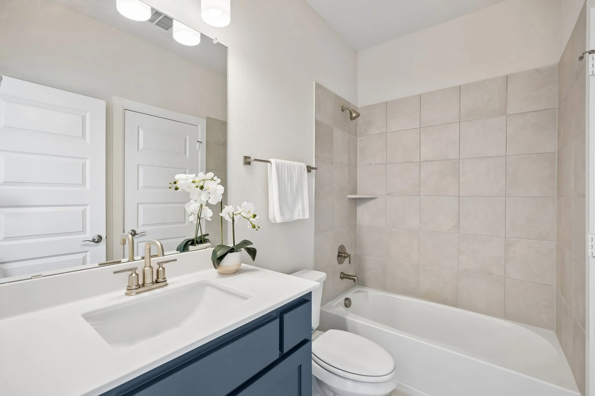 Well-Appointed Secondary Bedroom & Bath
Bright windows, a spacious layout, and an adjacent full bath provide comfort, convenience, and privacy.
