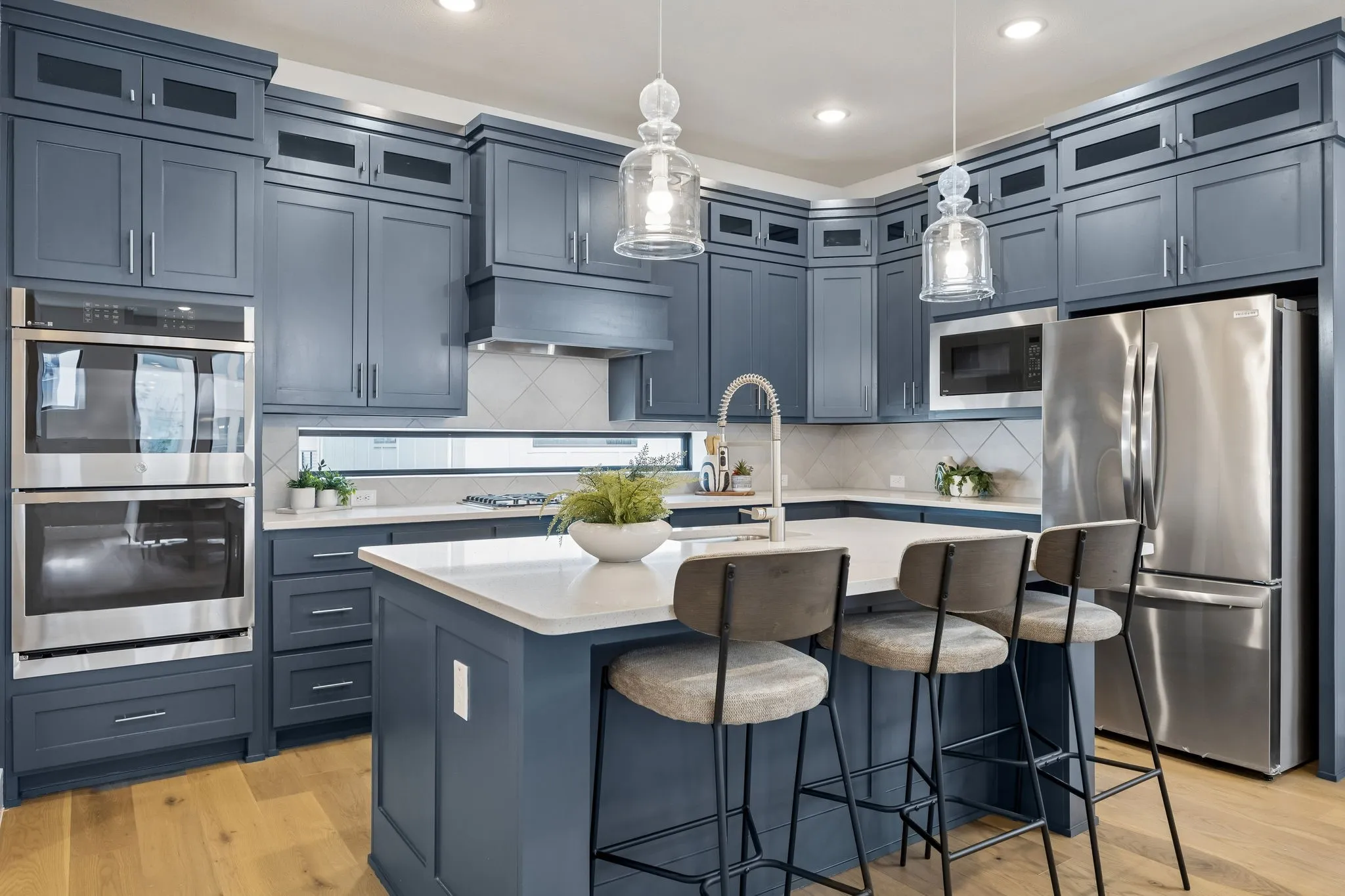 Gather Around the Island
With seating, prep space, and abundant storage, the oversized island serves as the centerpiece for casual dining and entertaining.