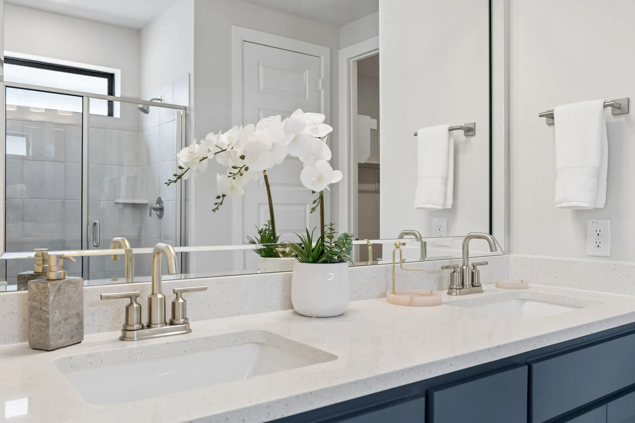 Dual-Vanity Owner’s Bath
A spacious vanity with two sinks, generous counter space, and modern finishes provides both convenience and style.