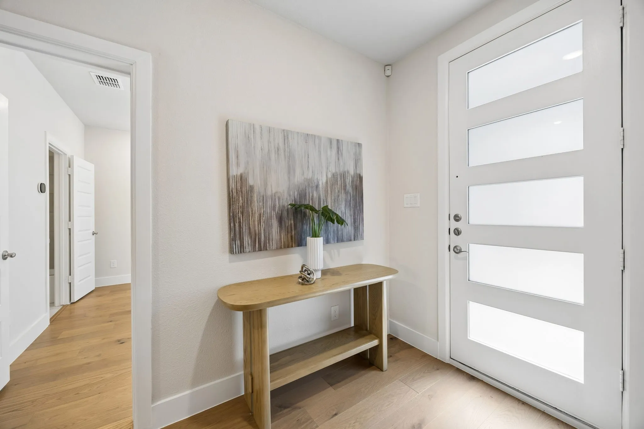 Thoughtful First Impressions
Natural light, modern finishes, and seamless flow make this entryway both functional and visually appealing.