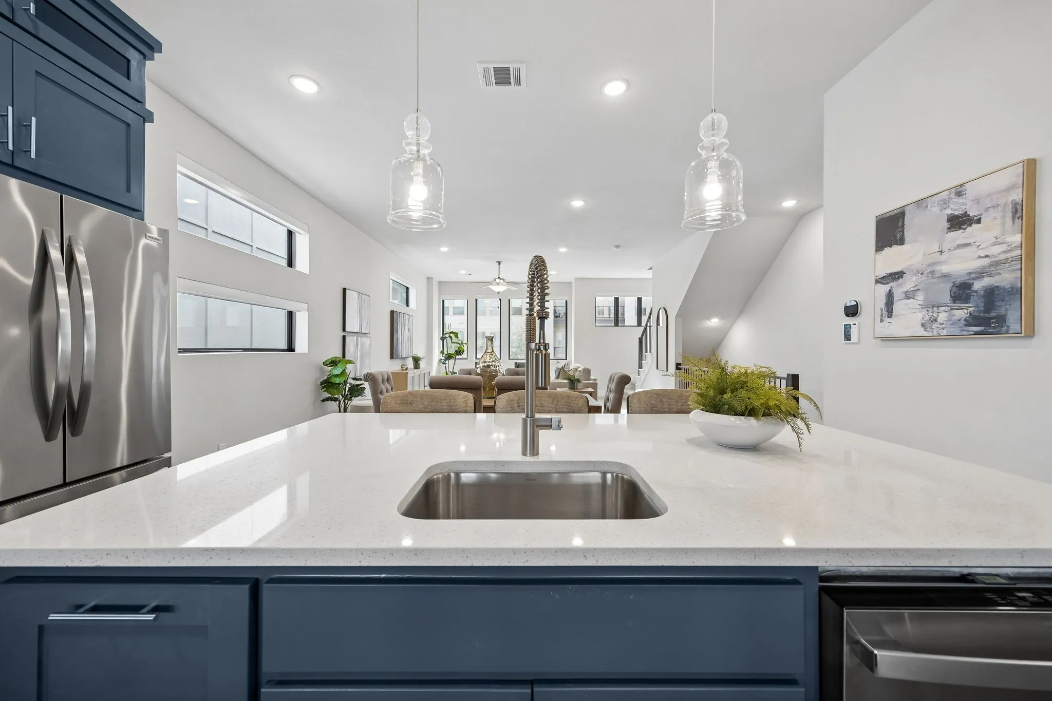 Function Meets Style
A sleek workstation island, stainless appliances, and extensive storage make meal preparation both efficient and enjoyable.